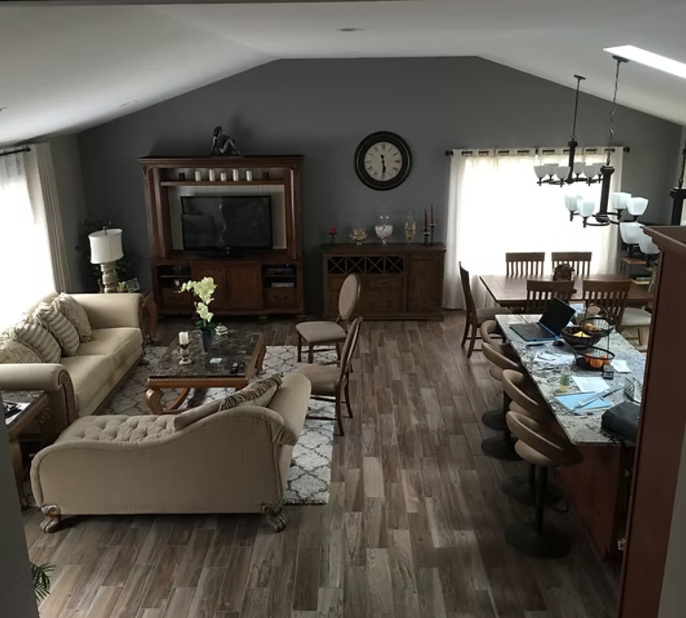 Modern kitchen renovation with new cabinetry, countertops, and stainless steel appliances