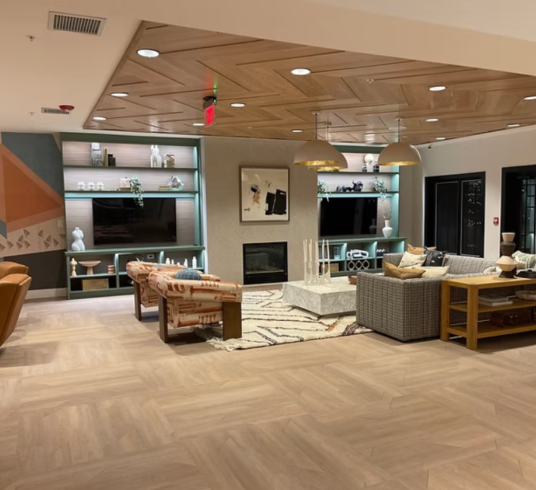 Modern commercial office space with updated flooring, lighting, and contemporary workstations