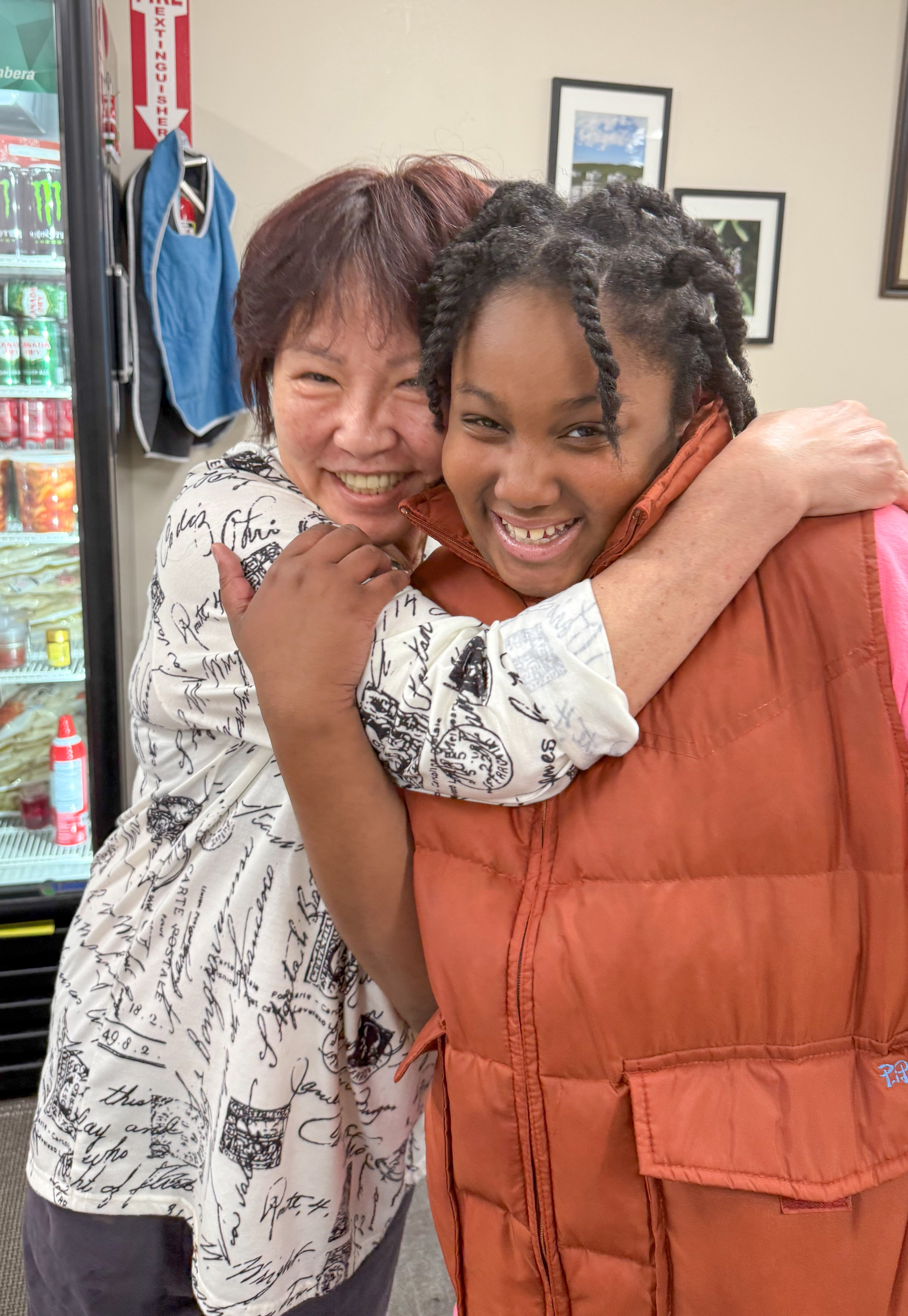 Owner hugging daughter