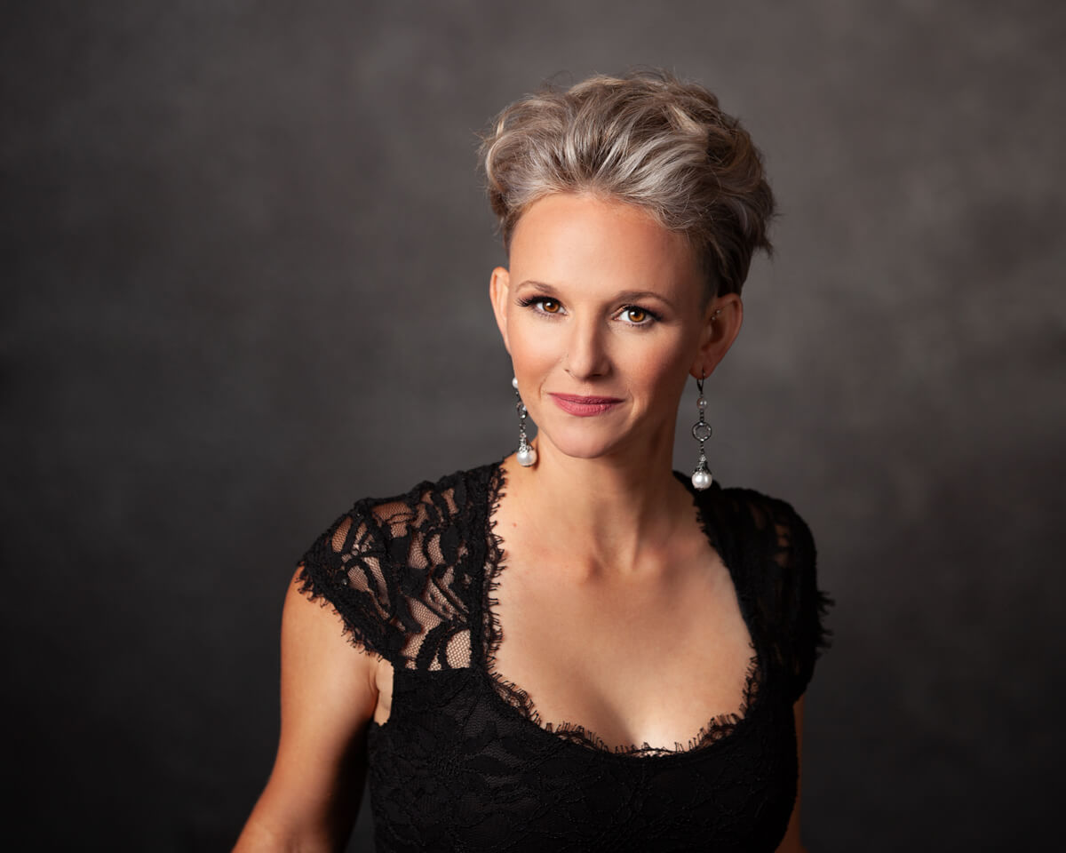 Glamour Portrait of Woman in Black lace dress confident smile from the eyes