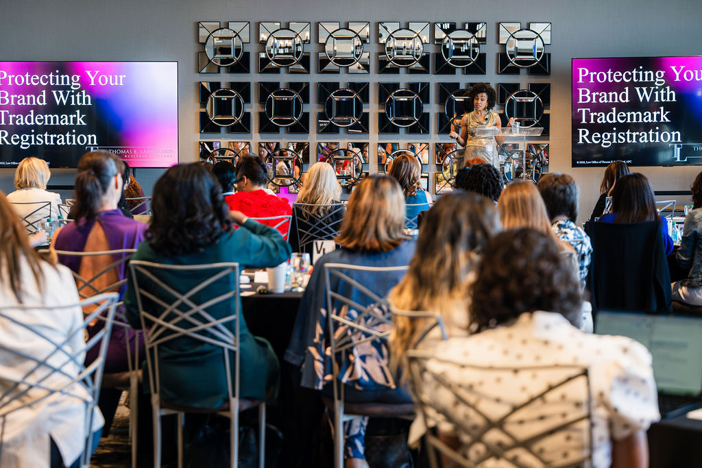 A speaker leading the room from the lectern at a WeSummit event