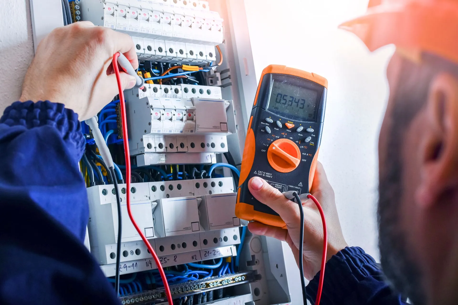 a person holding a multimeter