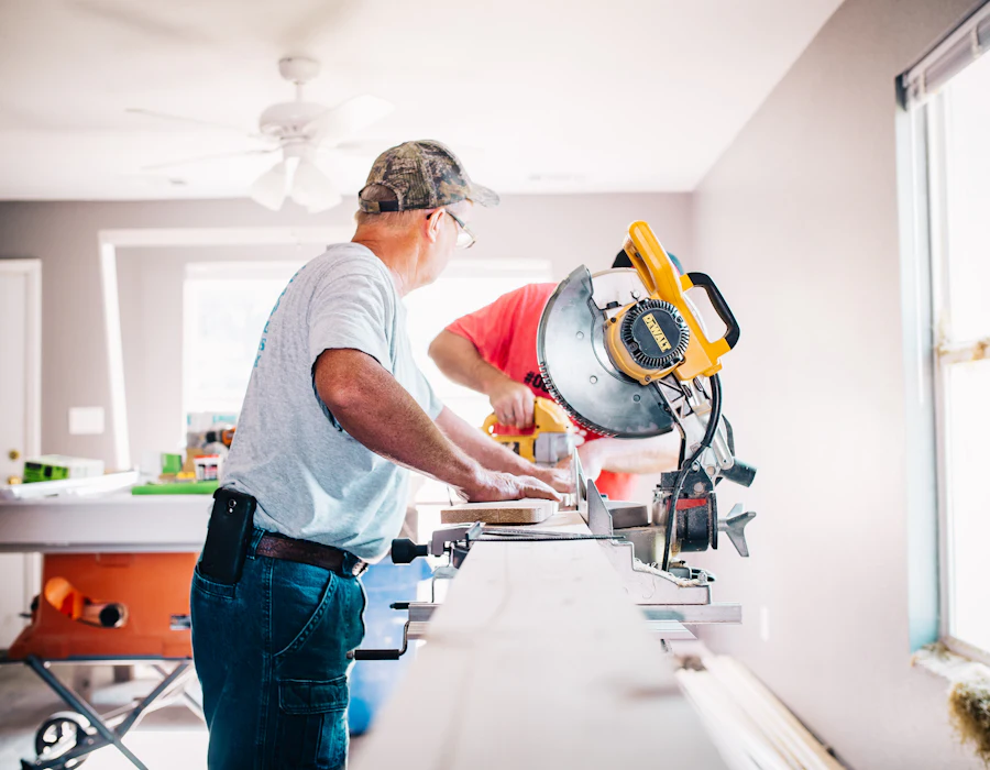 Craftsman cutting flooring trim
