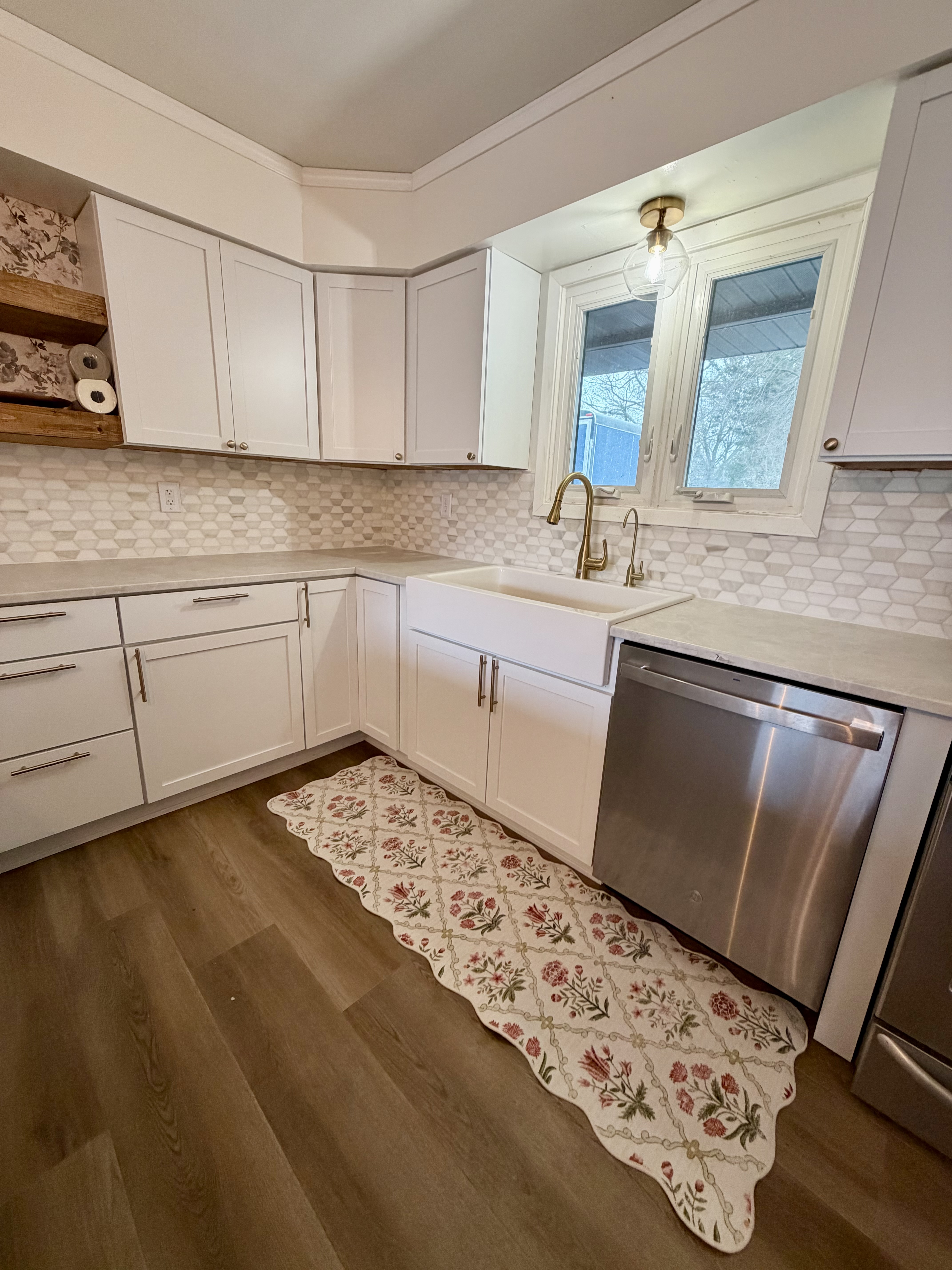 White kitchen cabinets around the sink