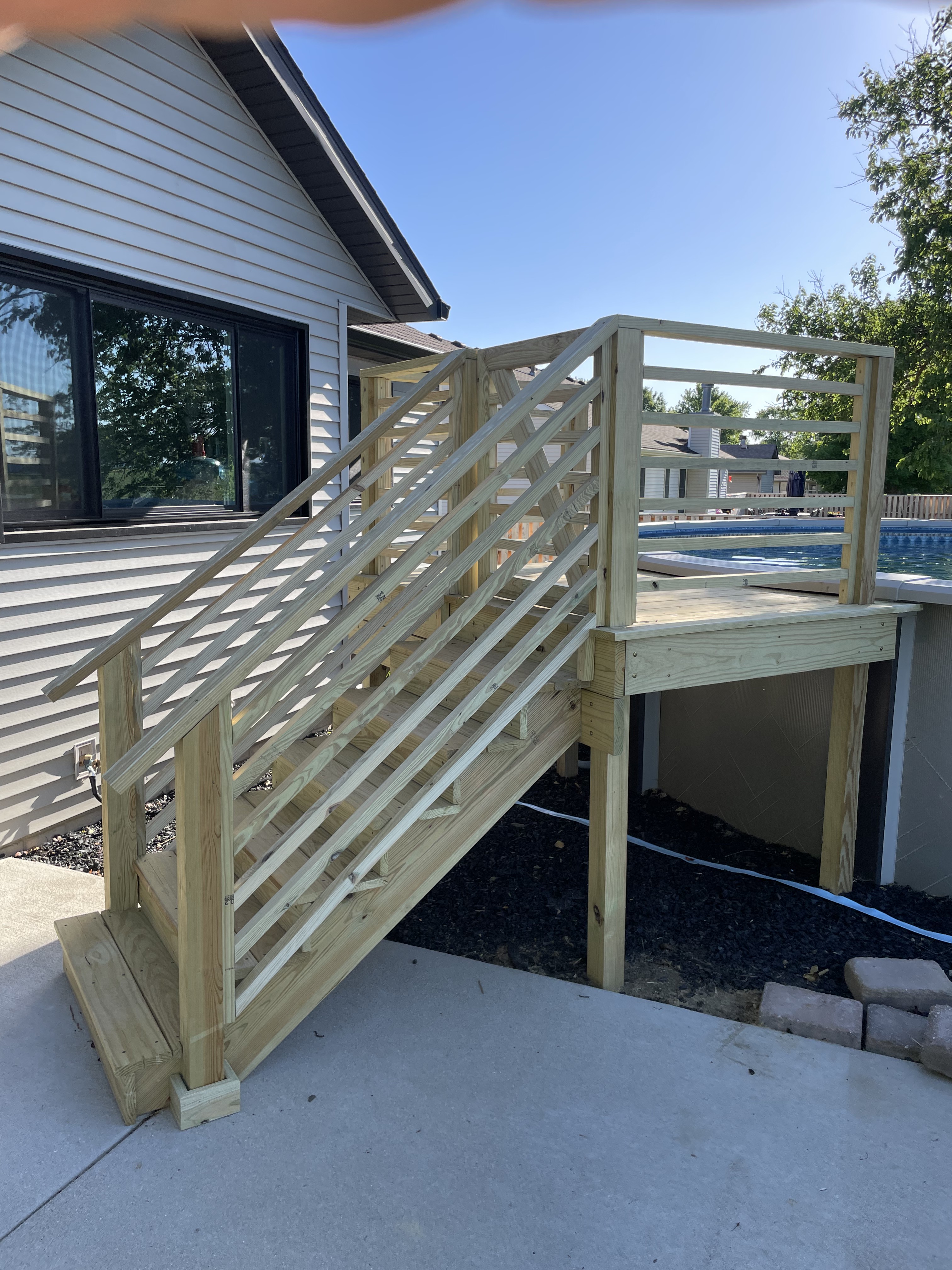 Wood pool deck stairs