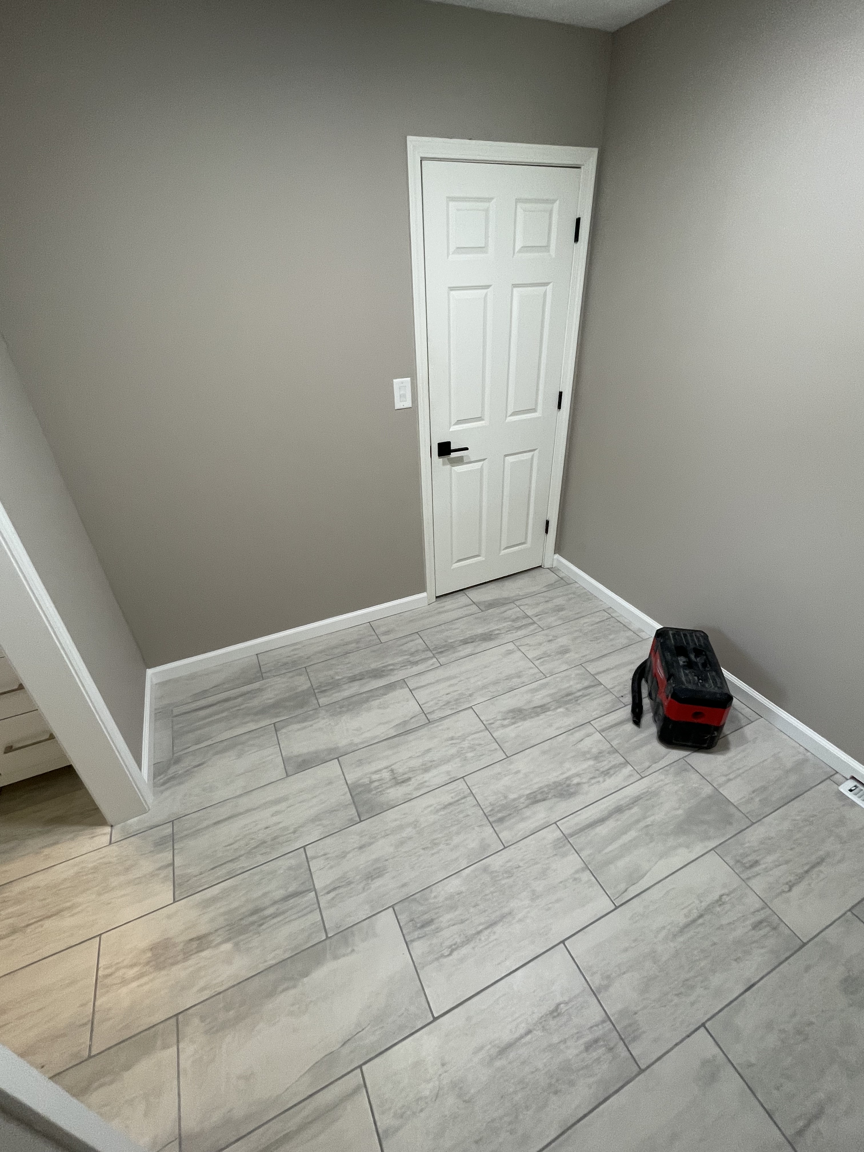 Gray tile floor and closet