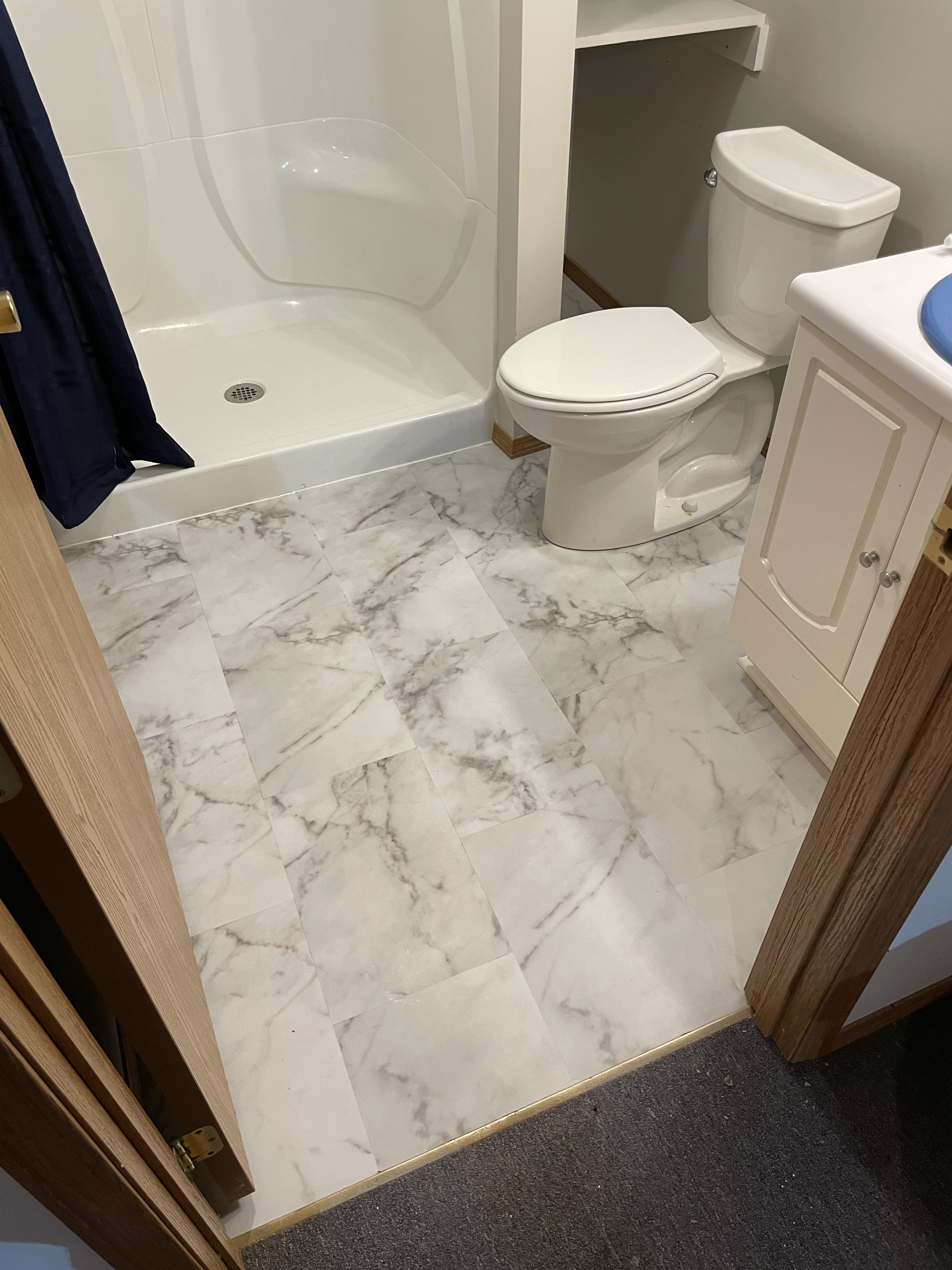 Bathroom with marble-look flooring