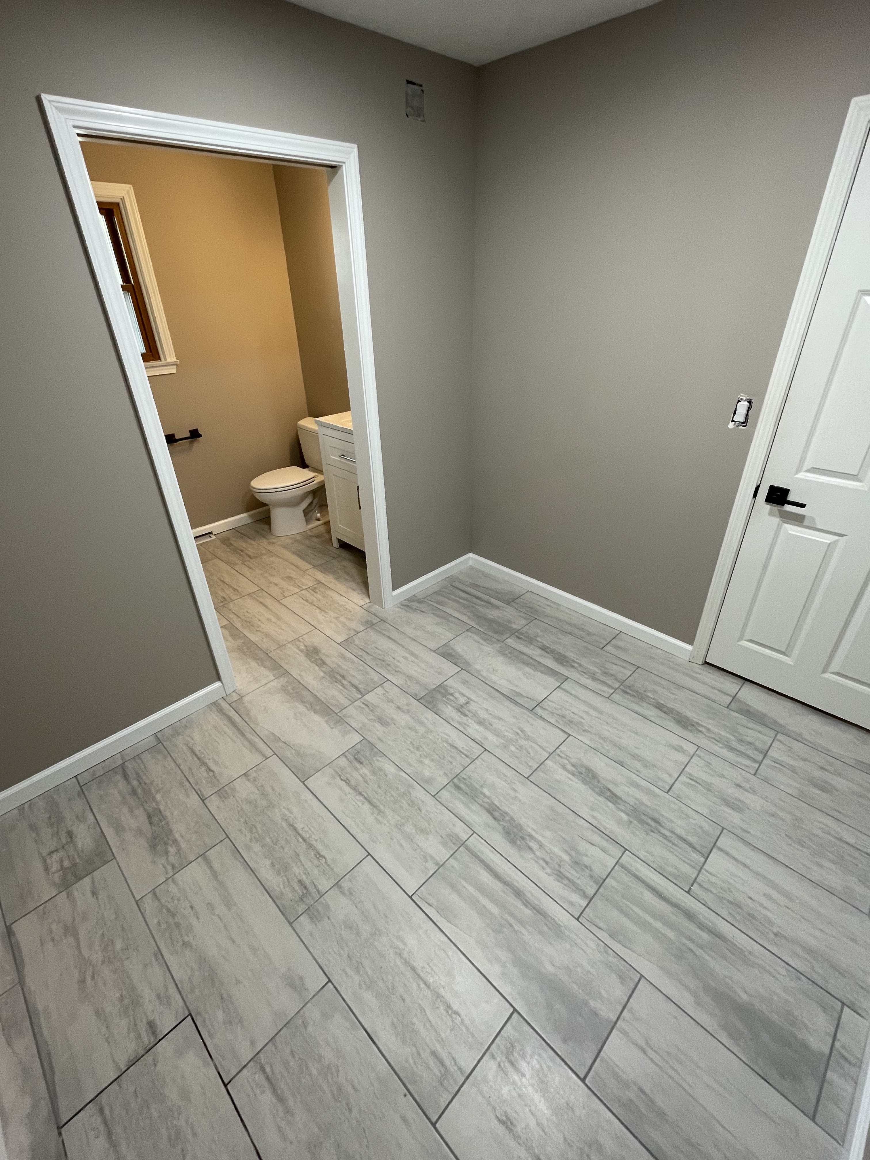 Gray tile floor and interior doors