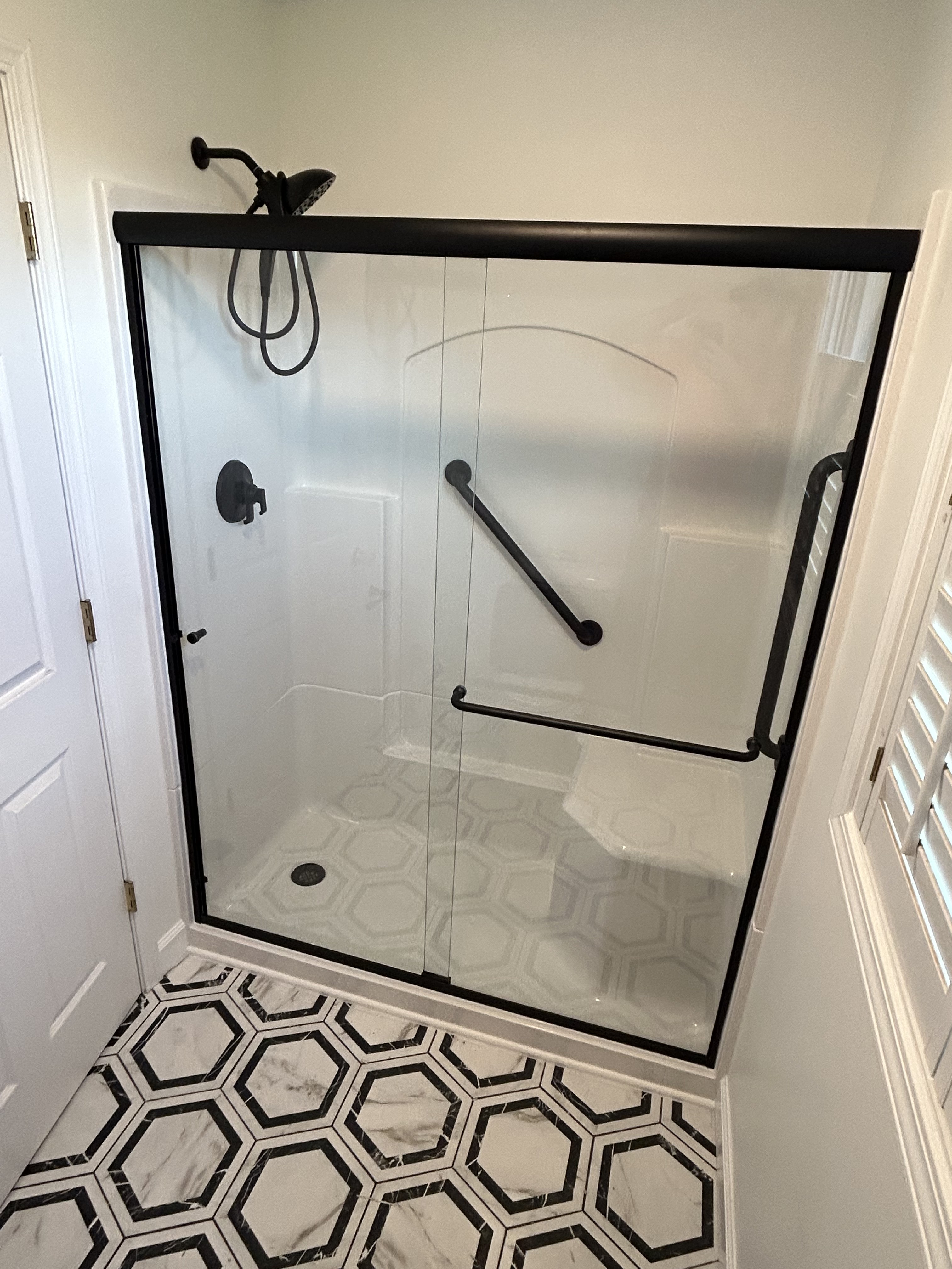 Finished shower with a black frame
