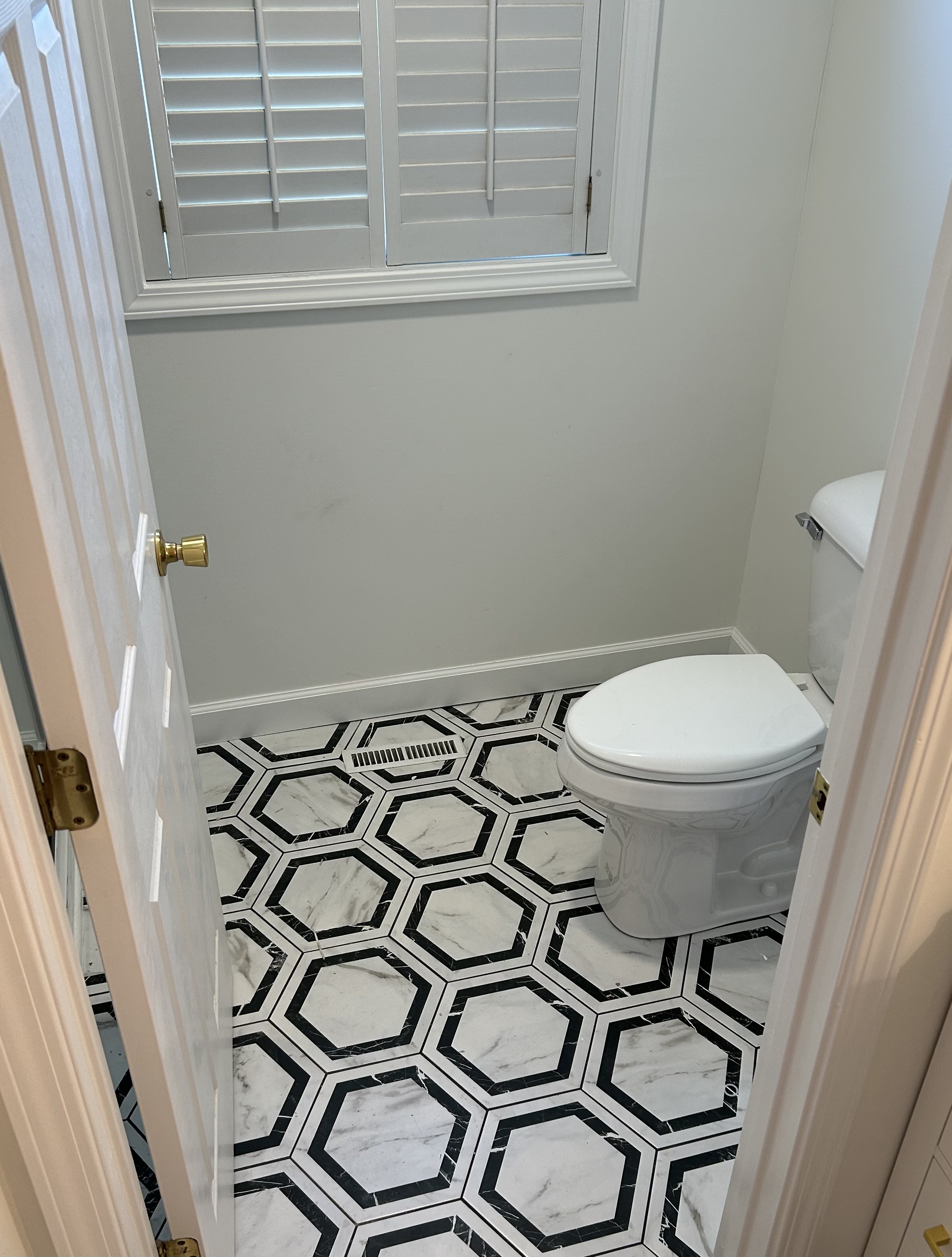 Finished bathroom toilet and tile floor