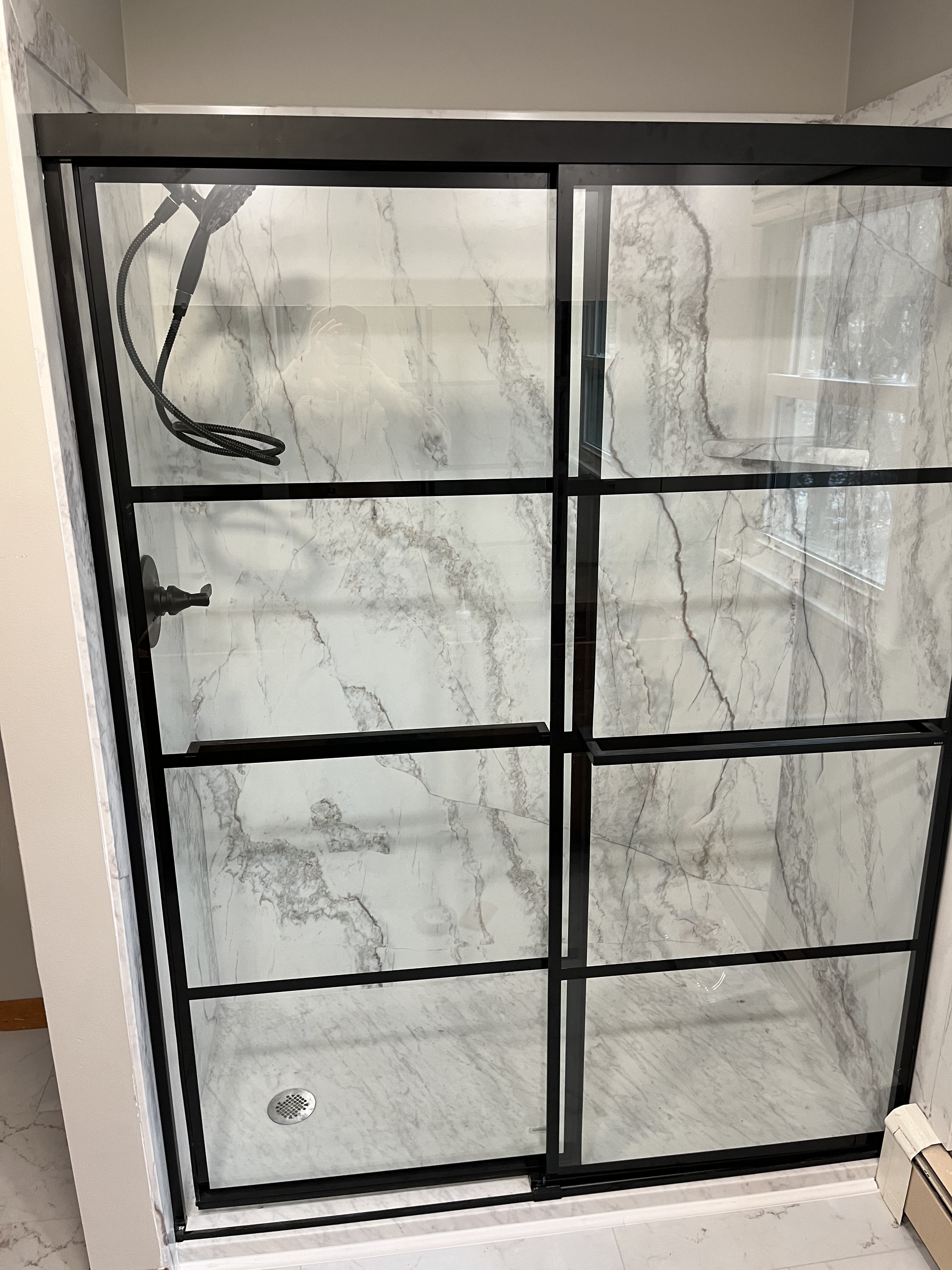 Shower with a black frame after remodeling