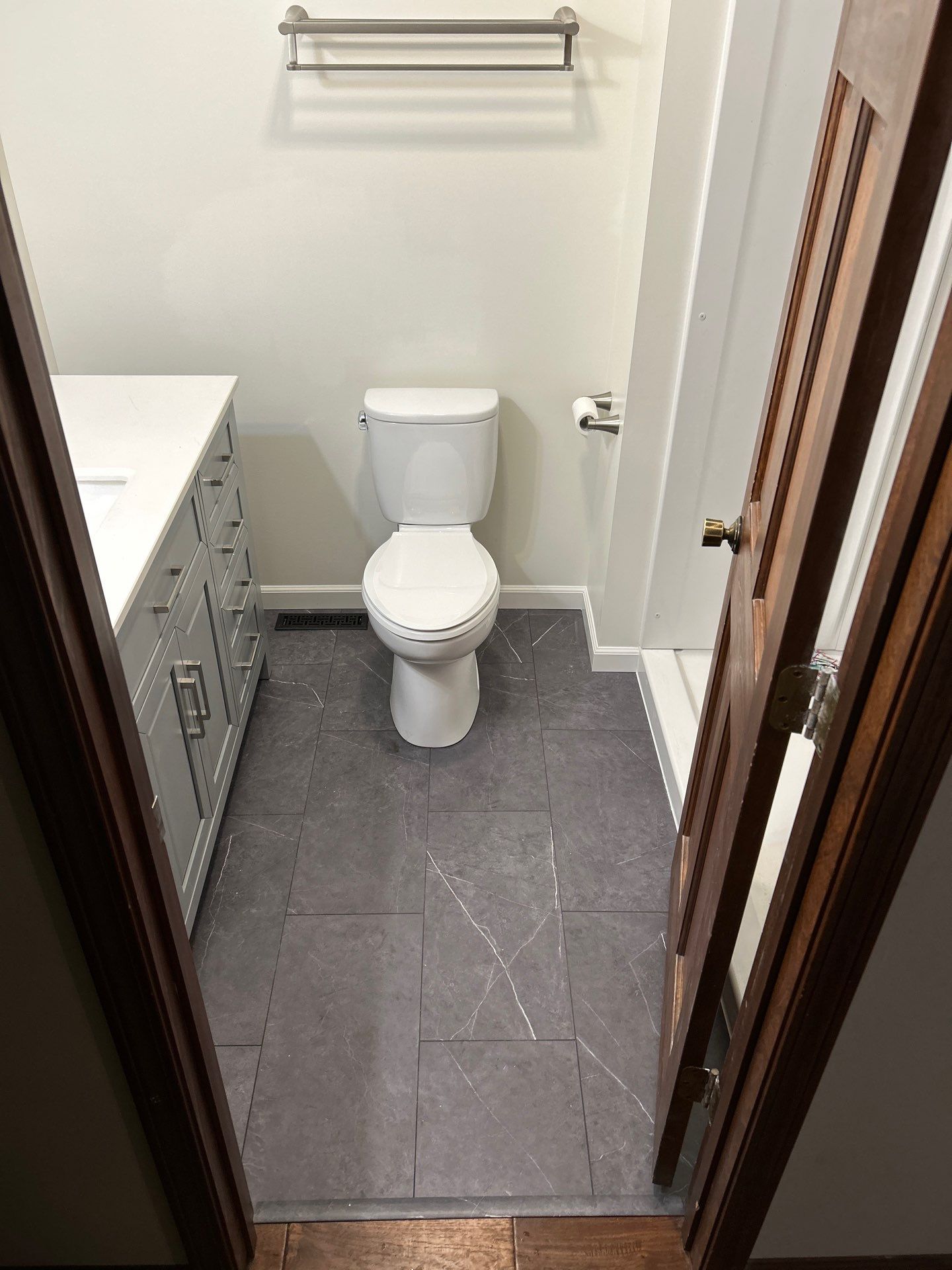 Tile floor and toilet after remodeling