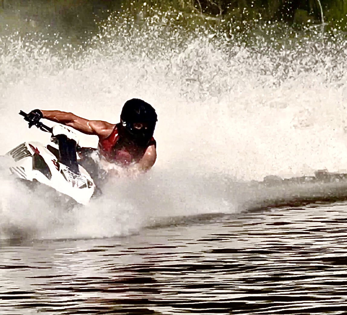 Dr. Andreas Boettcher racing a stand-up jet ski in his 50s