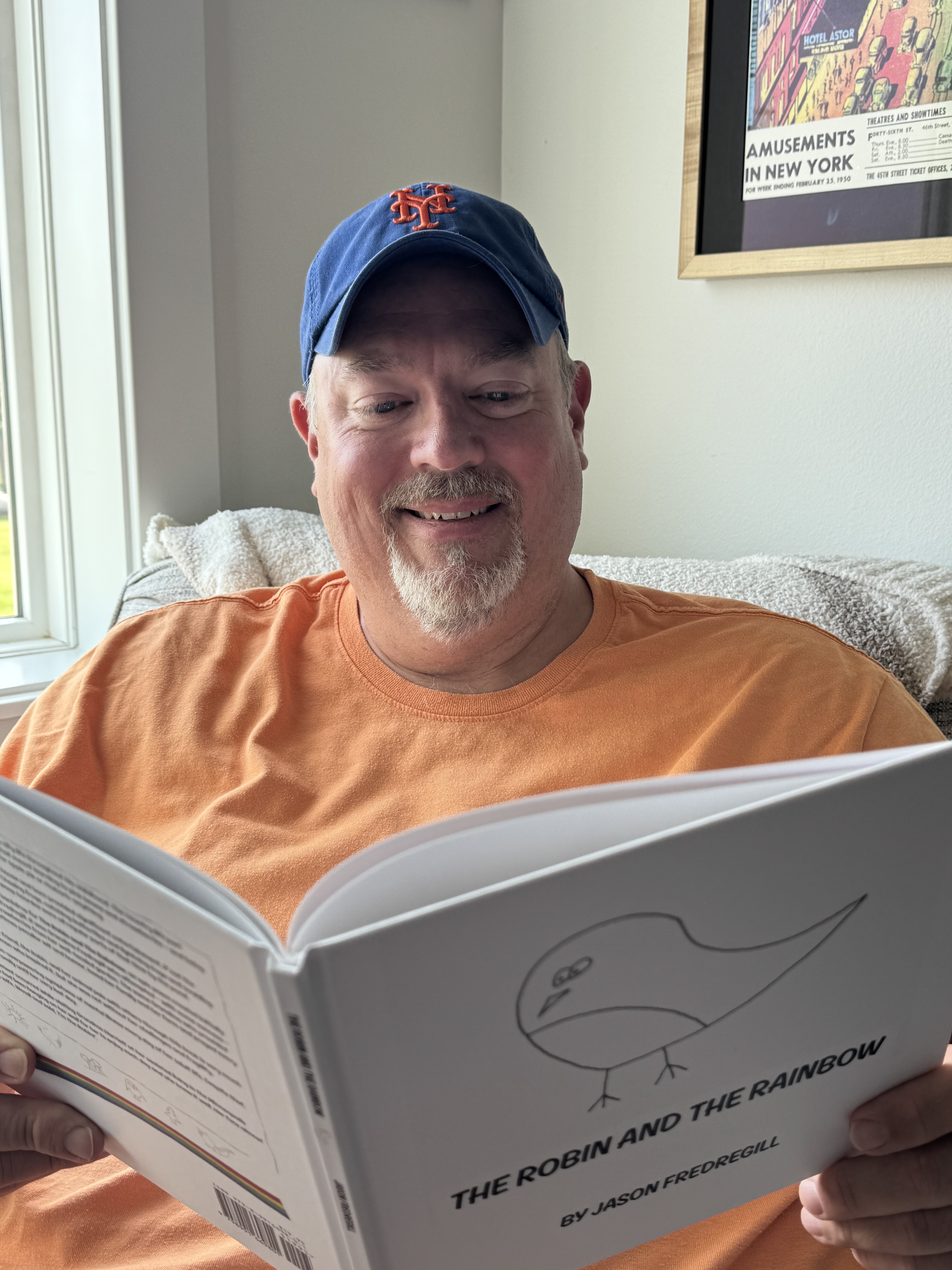 Jason Fredregill, author of the Faith Critters series, holding The Robin and the Rainbow