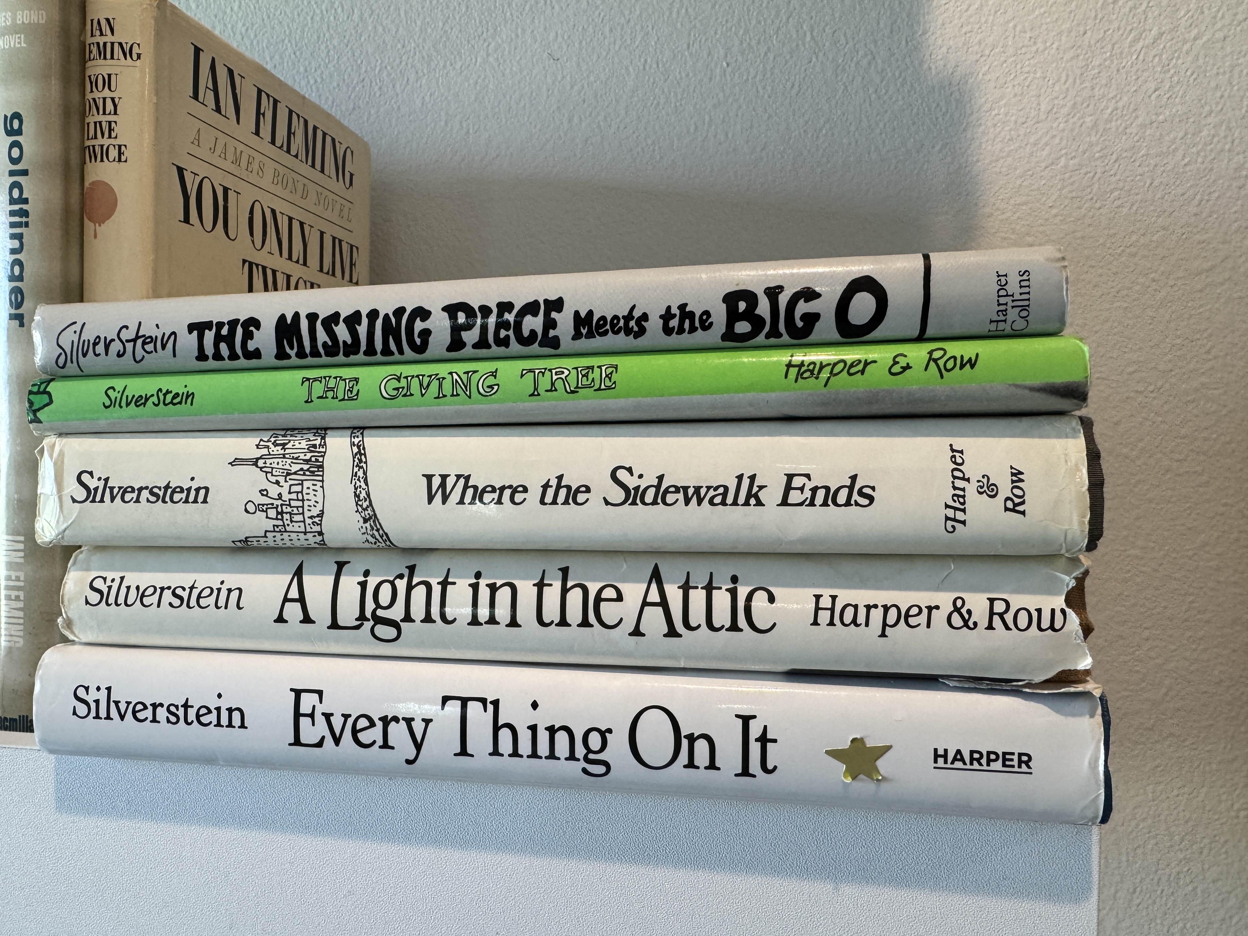 A stack of Shel Silverstein books — The Missing Piece Meets the Big O, The Giving Tree, Where the Sidewalk Ends, A Light in the Attic, and Every Thing On It — from Jason Fredregill's personal collection. A stack of Shel Silverstein books — The Missing Piece Meets the Big O, The Giving Tree, Where the Sidewalk Ends, A Light in the Attic, and Every Thing On It — from Jason Fredregill's personal collection.