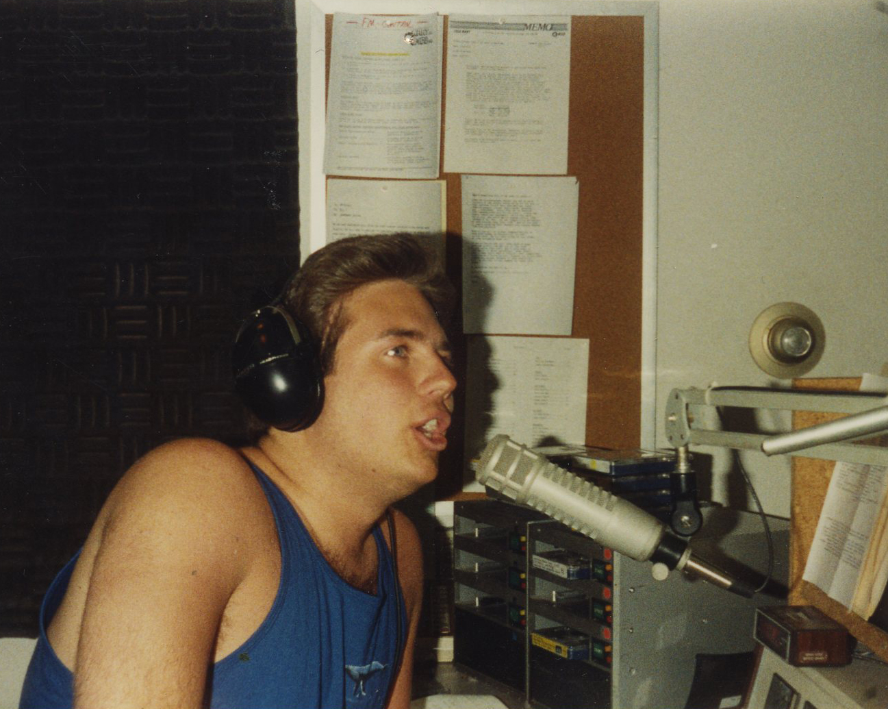 Young Jason Fredregill operating a radio broadcast board