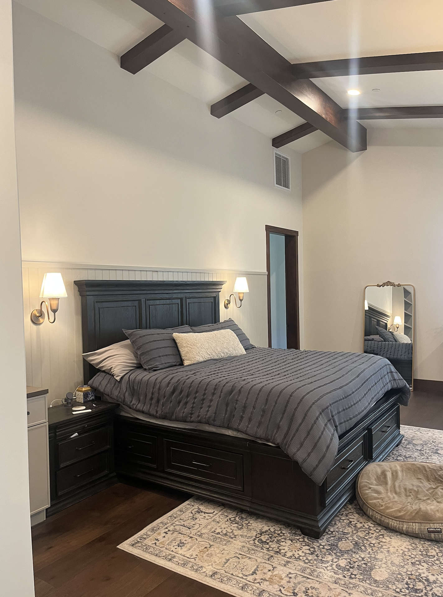 Primary bedroom with vaulted beam ceiling
