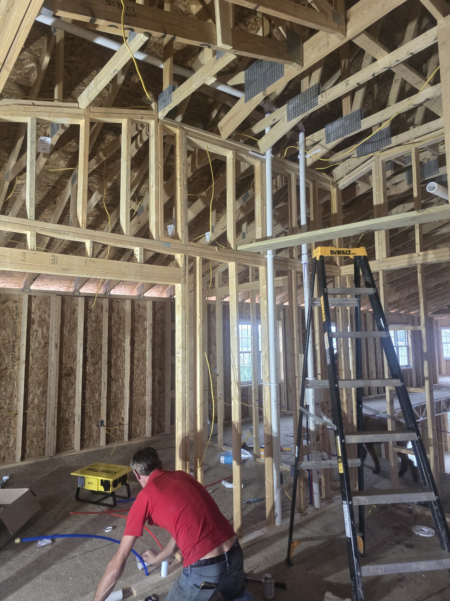 Overhead basement drainage and sanitary pipe network during plumbing inspection