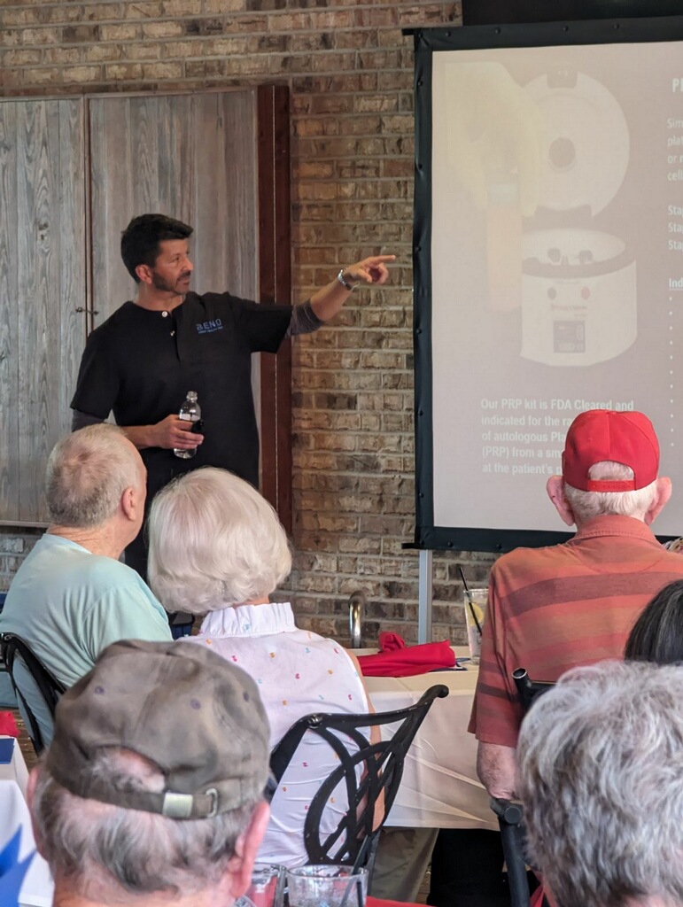 James Epolito interacting with attendees during a live regenerative medicine educational seminar