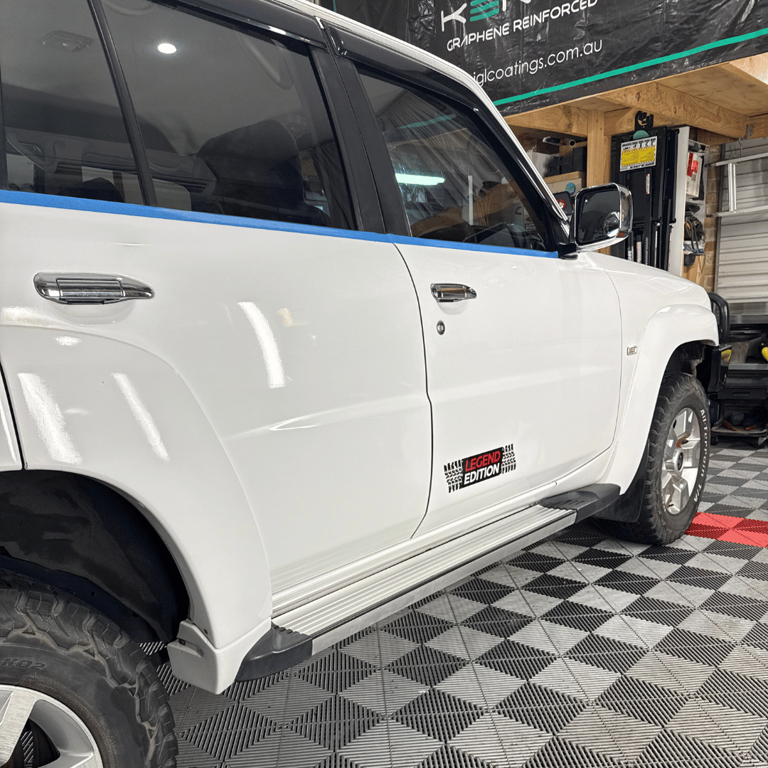 White truck parked in detailing studio
