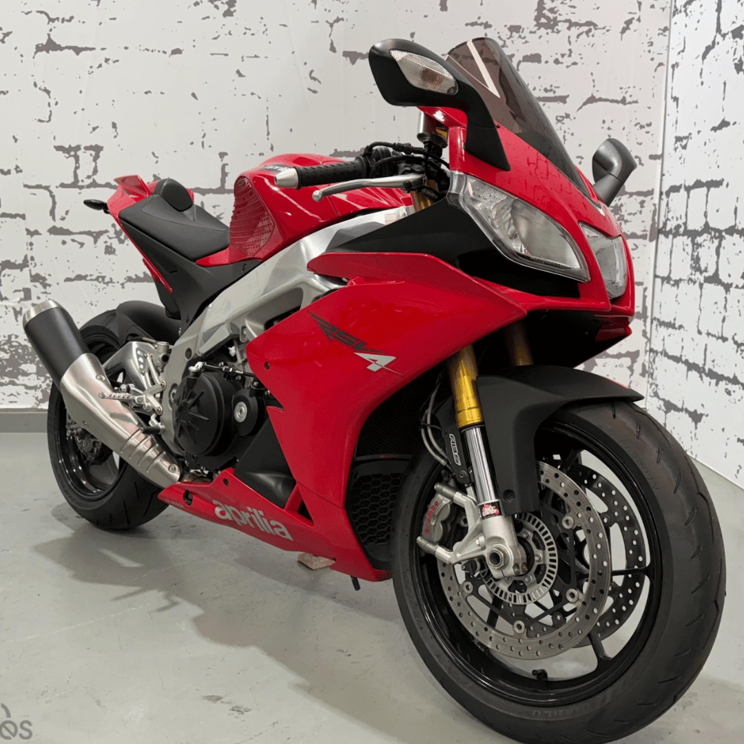 Red bike parked in a detailing studio
