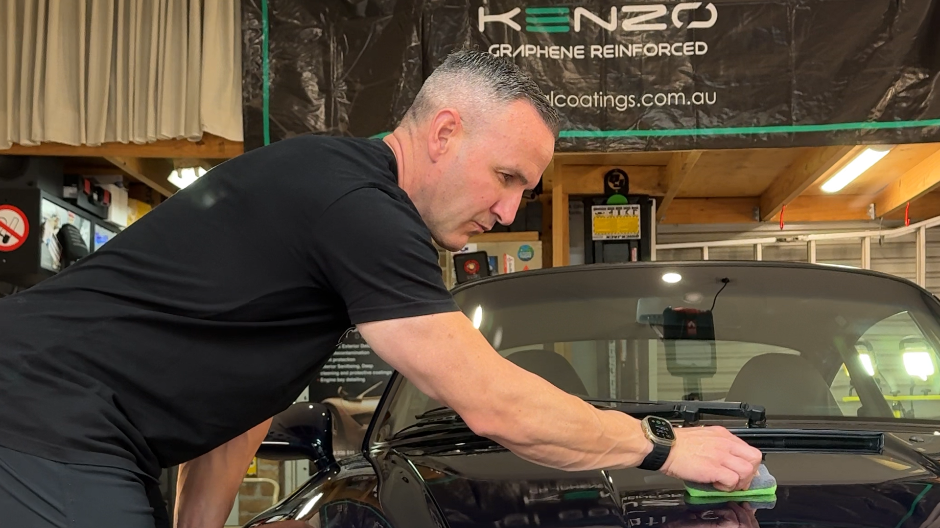Tim Martin applying ceramic coating on a Porsche