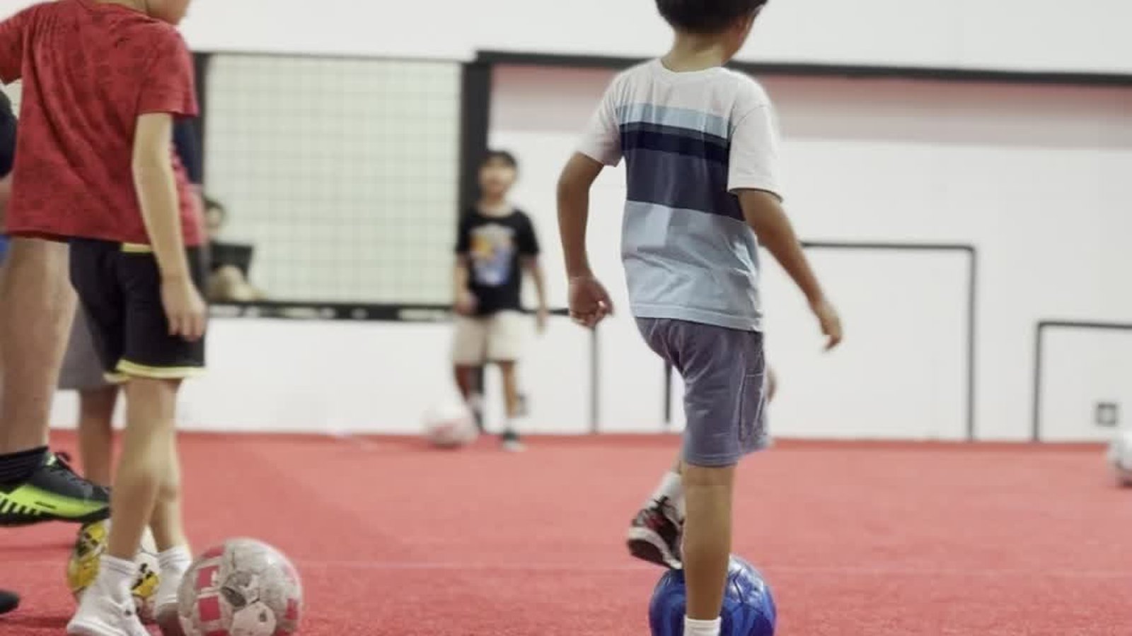 Panther Soccer player dribbling during indoor training
