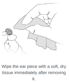 Hand wiping the ear piece with a soft, dry tissue immediately after removal