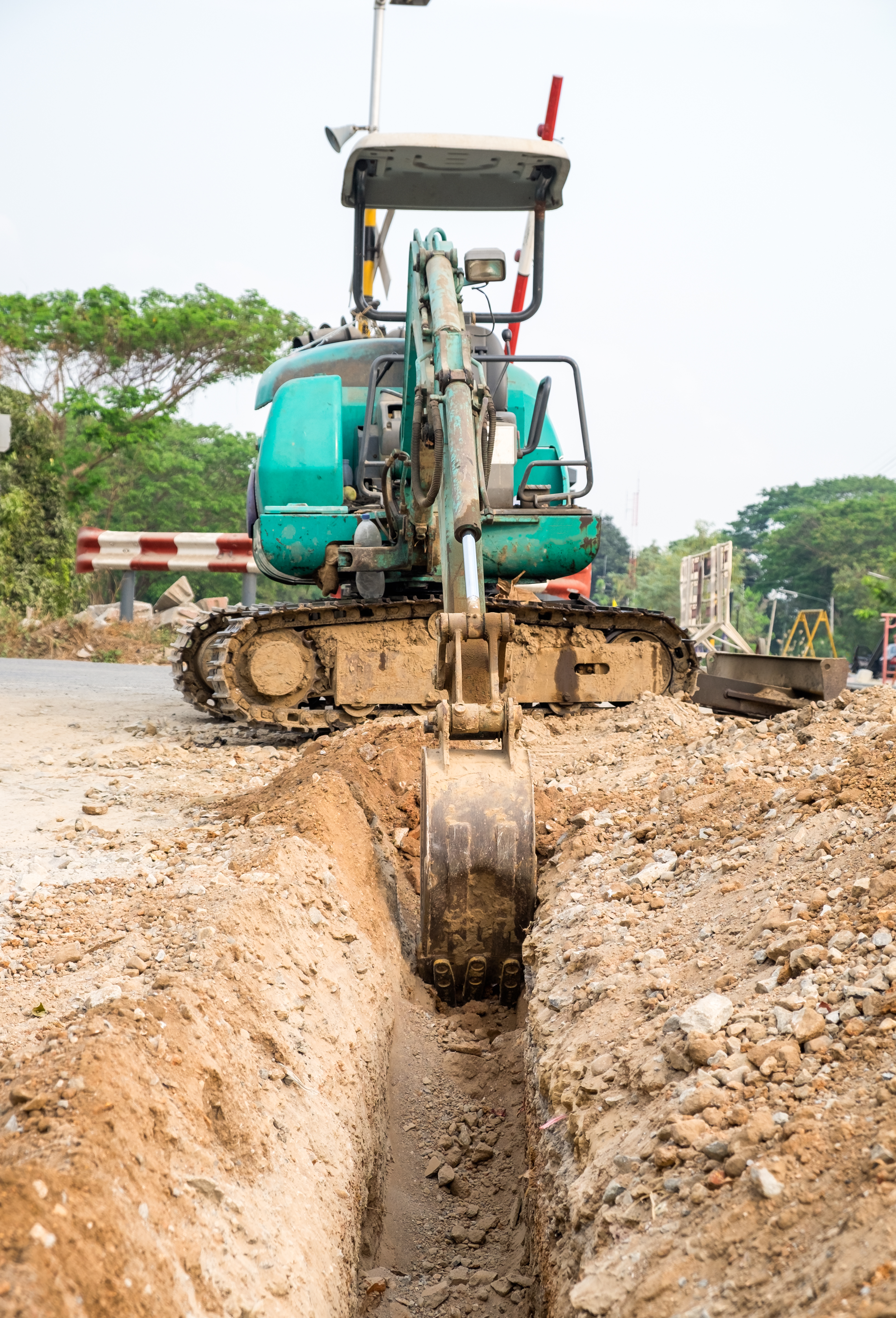 Excavation digger scooping a trench