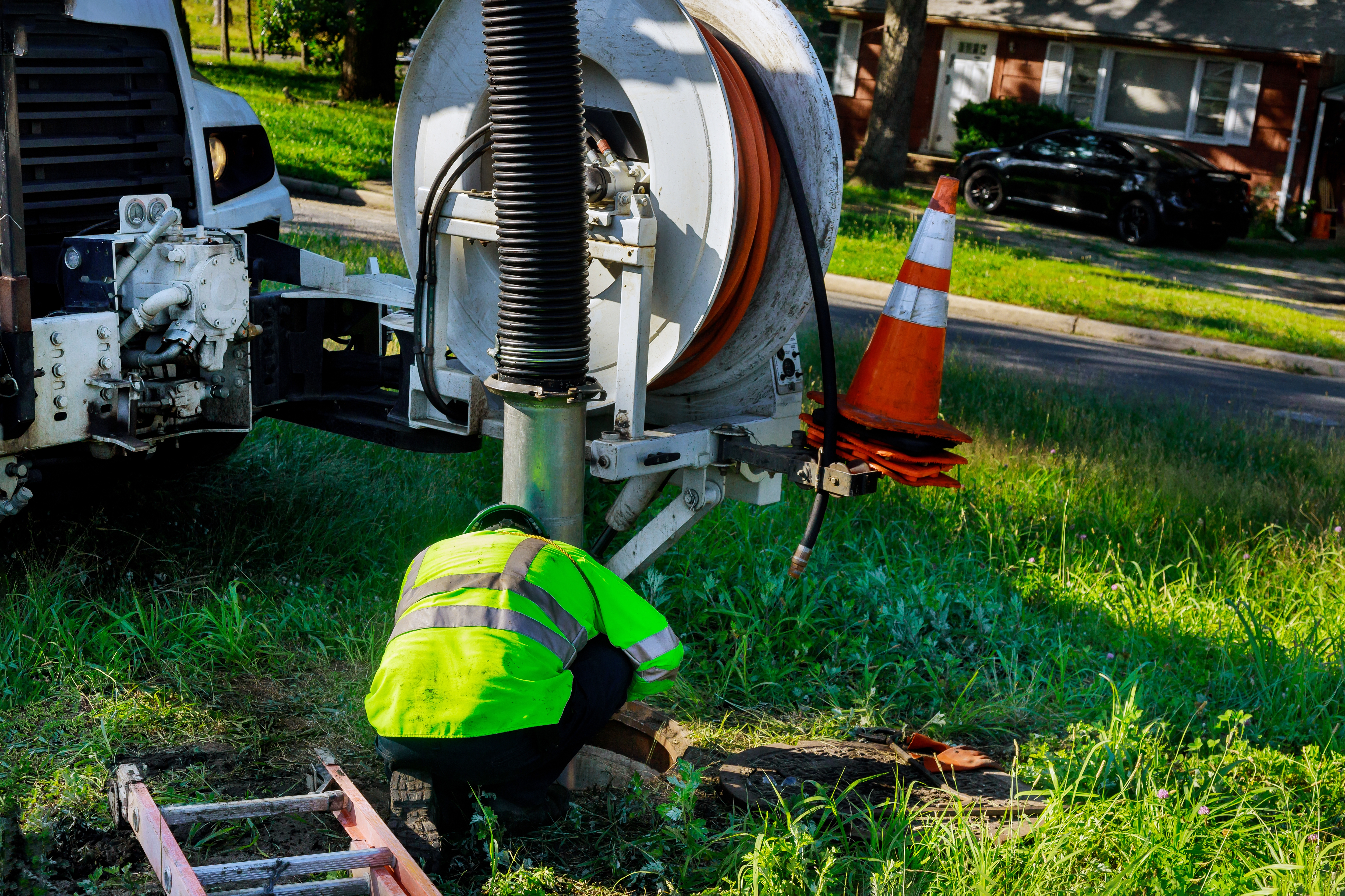 Man cleaning sewer system
