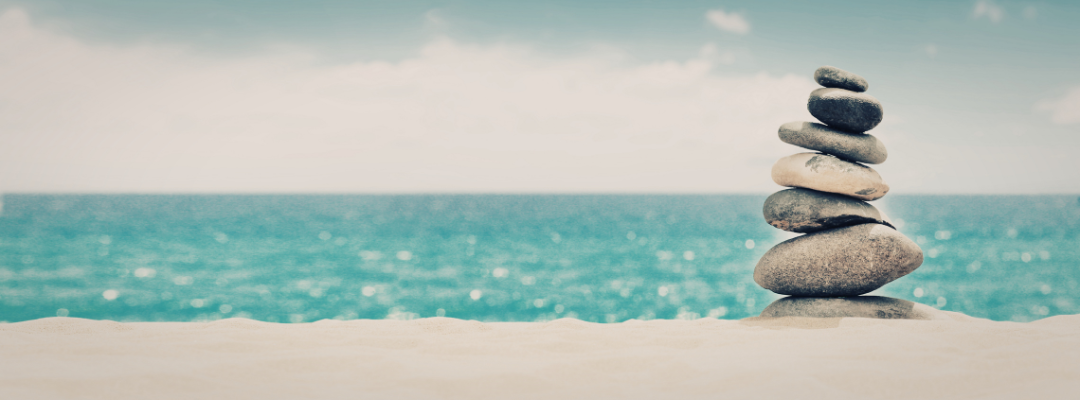 Stacked stones representing grounded clarity and direction