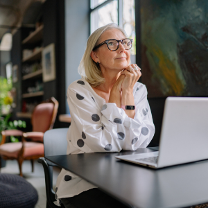 A woman wondering where to begin writing A woman wondering where to begin writing