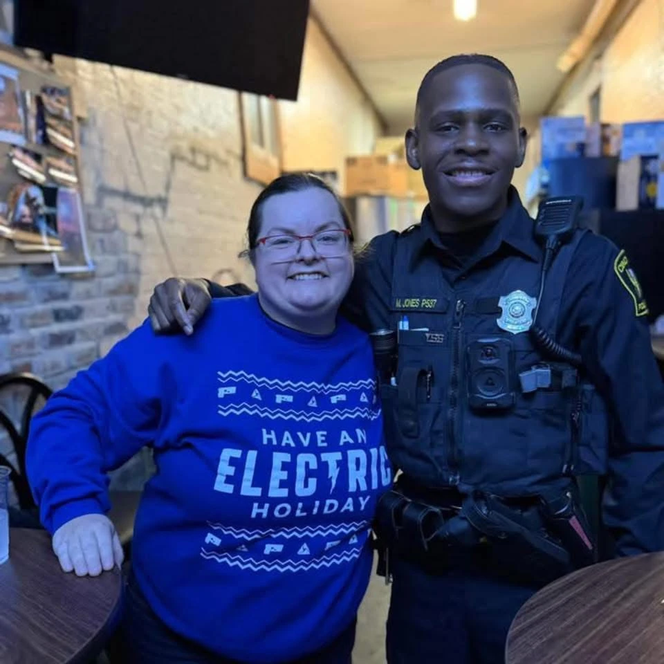 Marcellus Jones with a community member he served