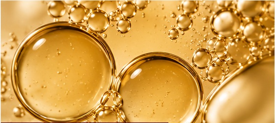 Golden macro texture of rambutan seed oil