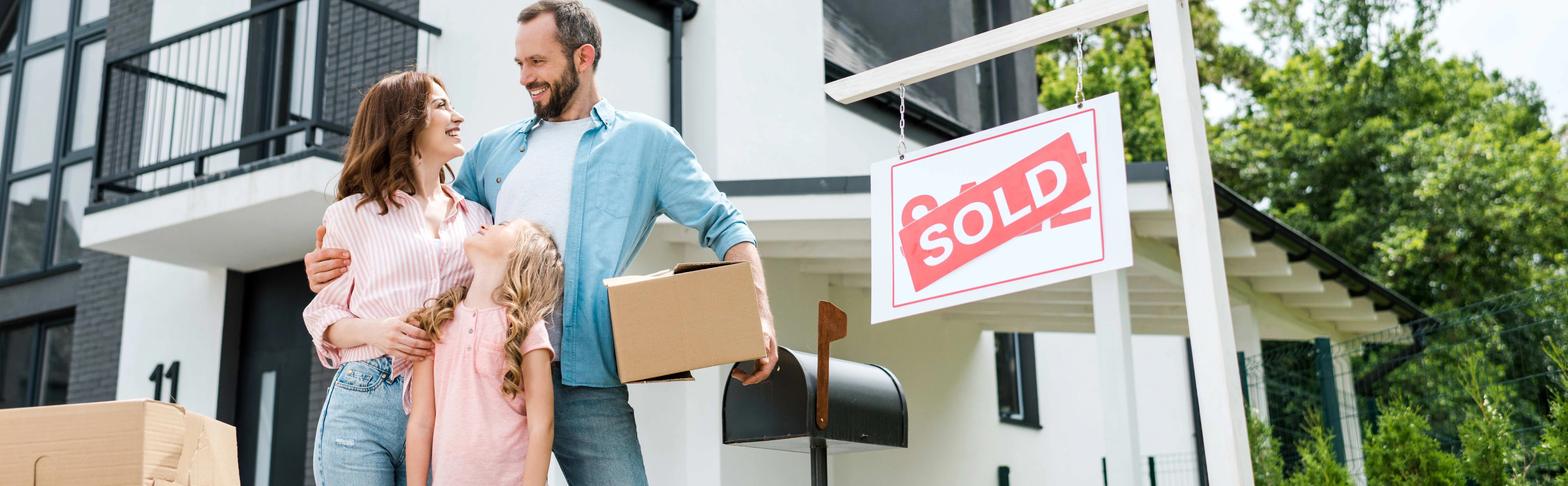 A picture of a happy family who just sold their house.