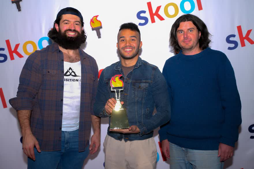 Diego Rivera holding the Skool Games trophy with Alex Hormozi and Sam Ovens