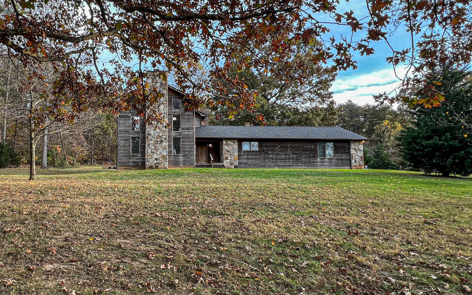 A distinctive East Tennessee residence surrounded by open land and natural landscape