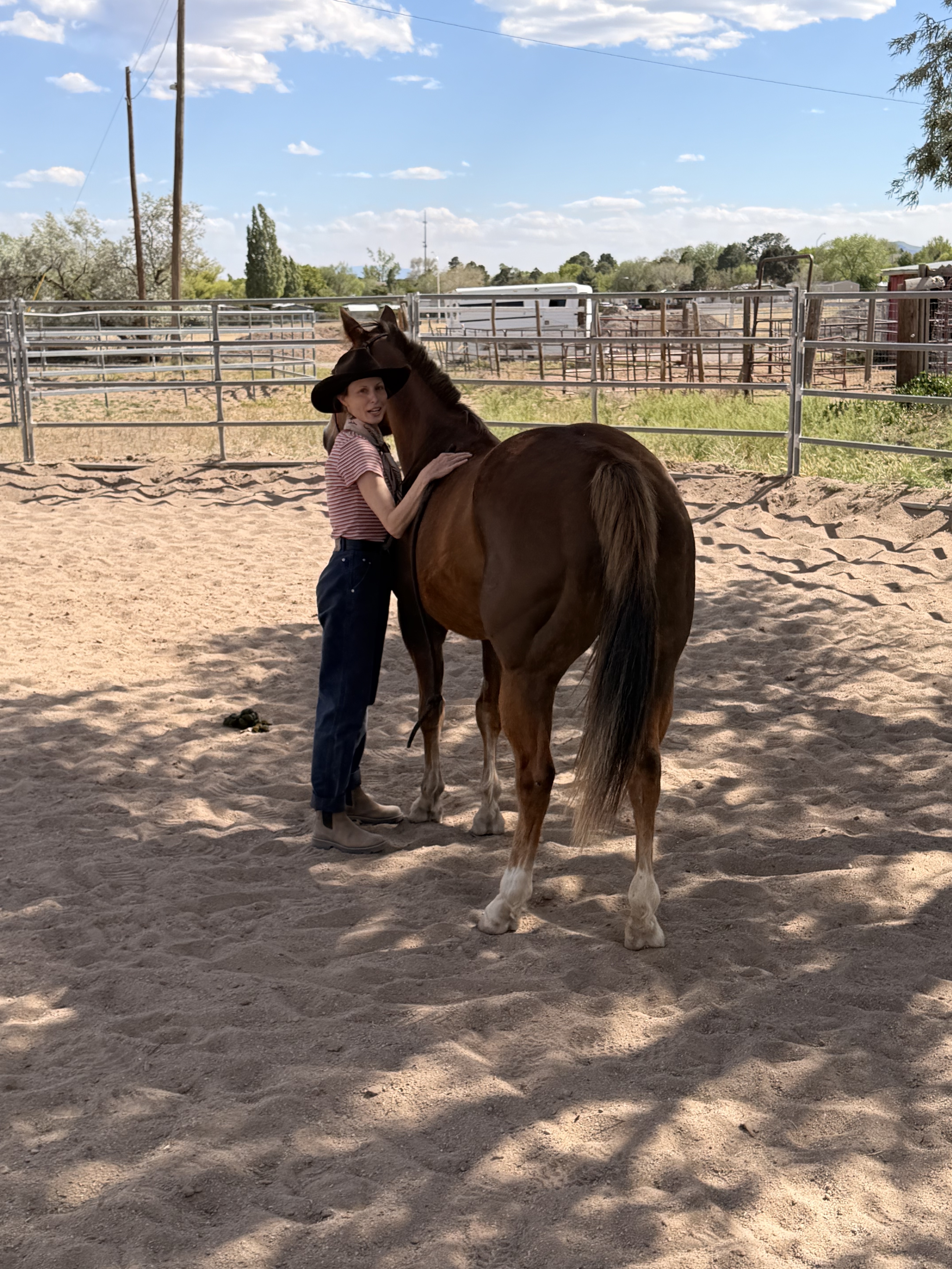 Faye with her horse in the round pen
