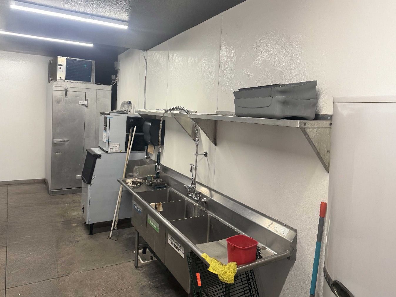 Professional FRP fiberglass reinforced panel installation in commercial kitchen