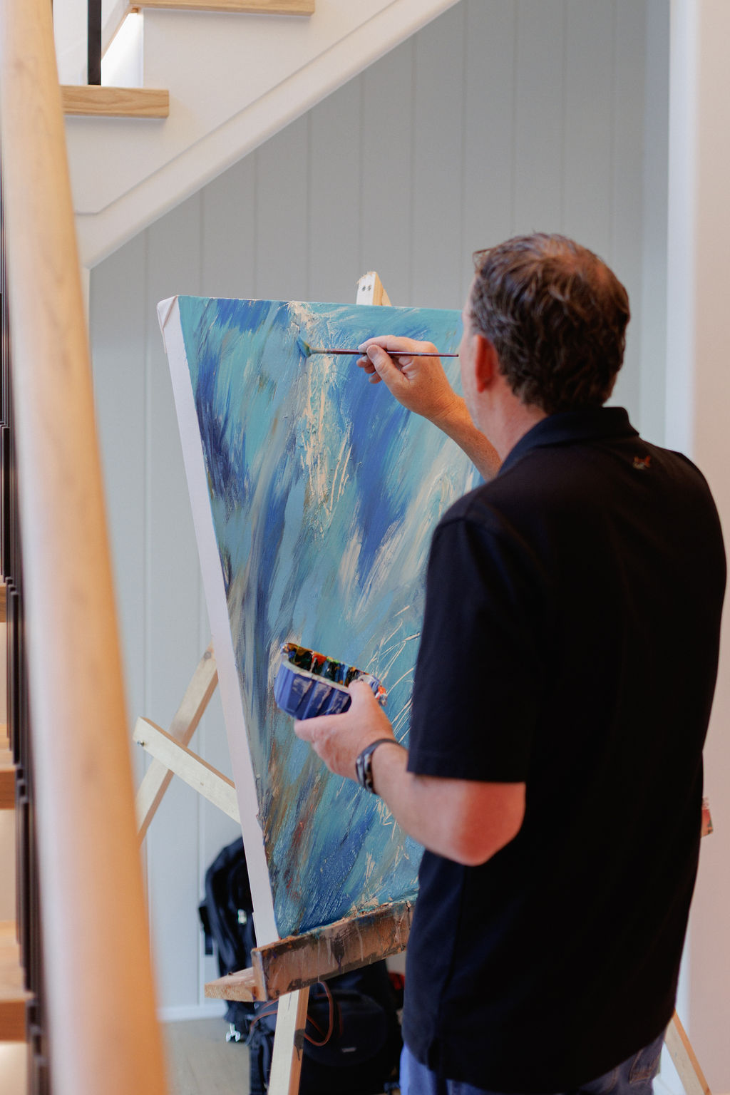 Large abstract paintings by Christophaer Bartosik displayed in a luxury modern spaces
