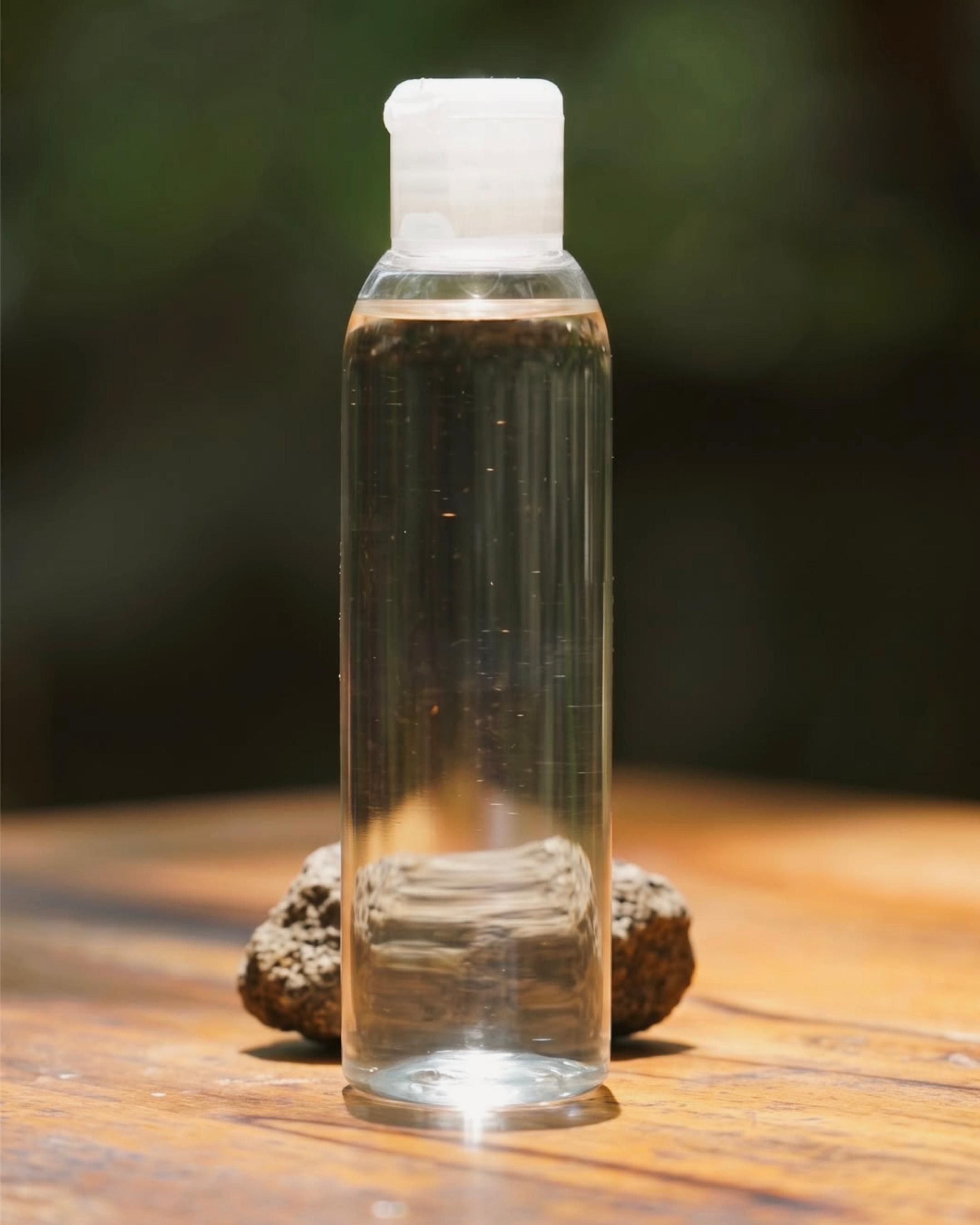 A bottle of Kinaiya virgin coconut oil in the sun