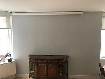 Completed projection setup with lights dimmed and shades closed