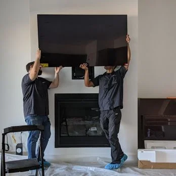 TV being mounted with hidden wiring