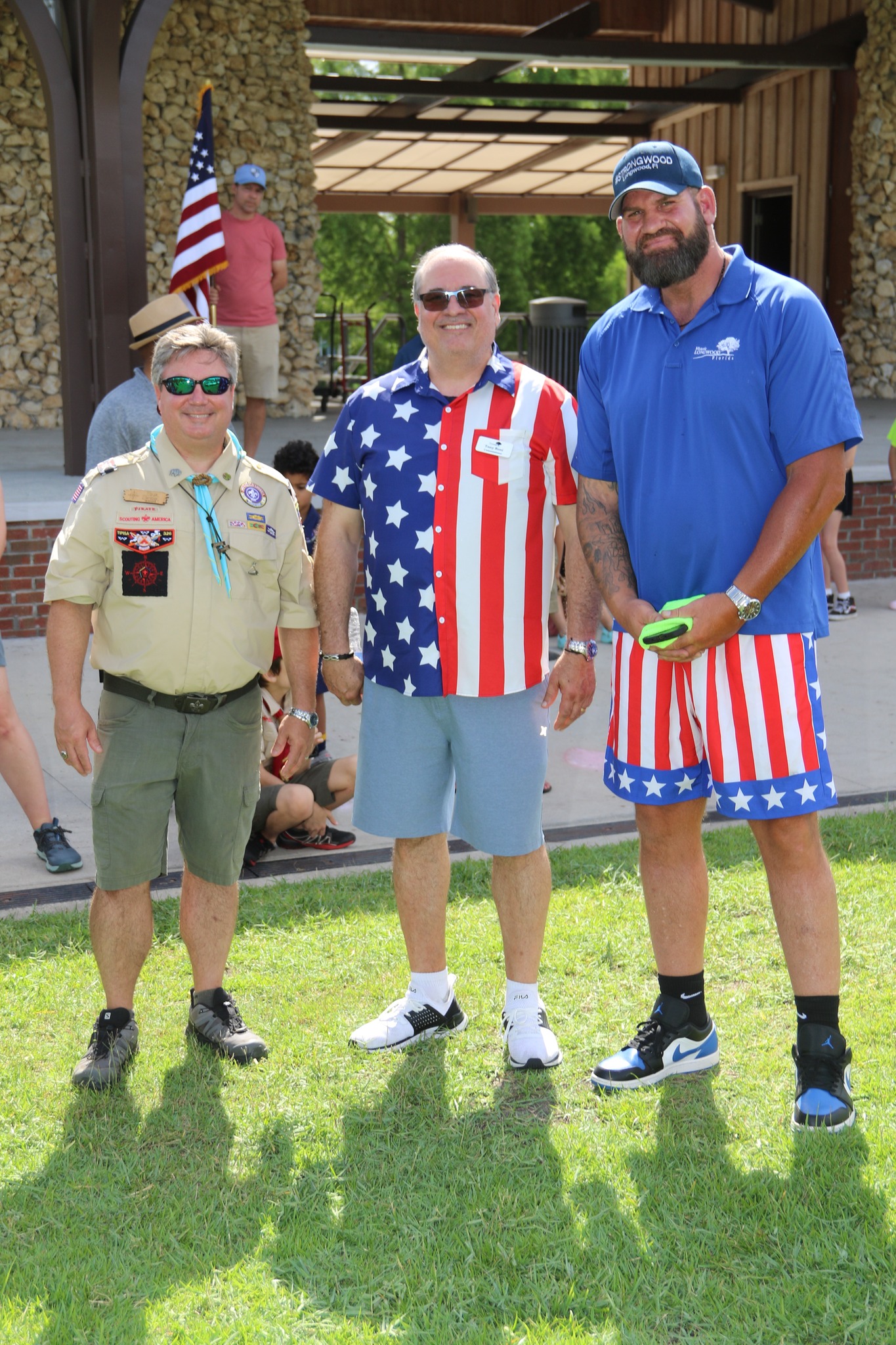 Scouts with the American flag at a parade