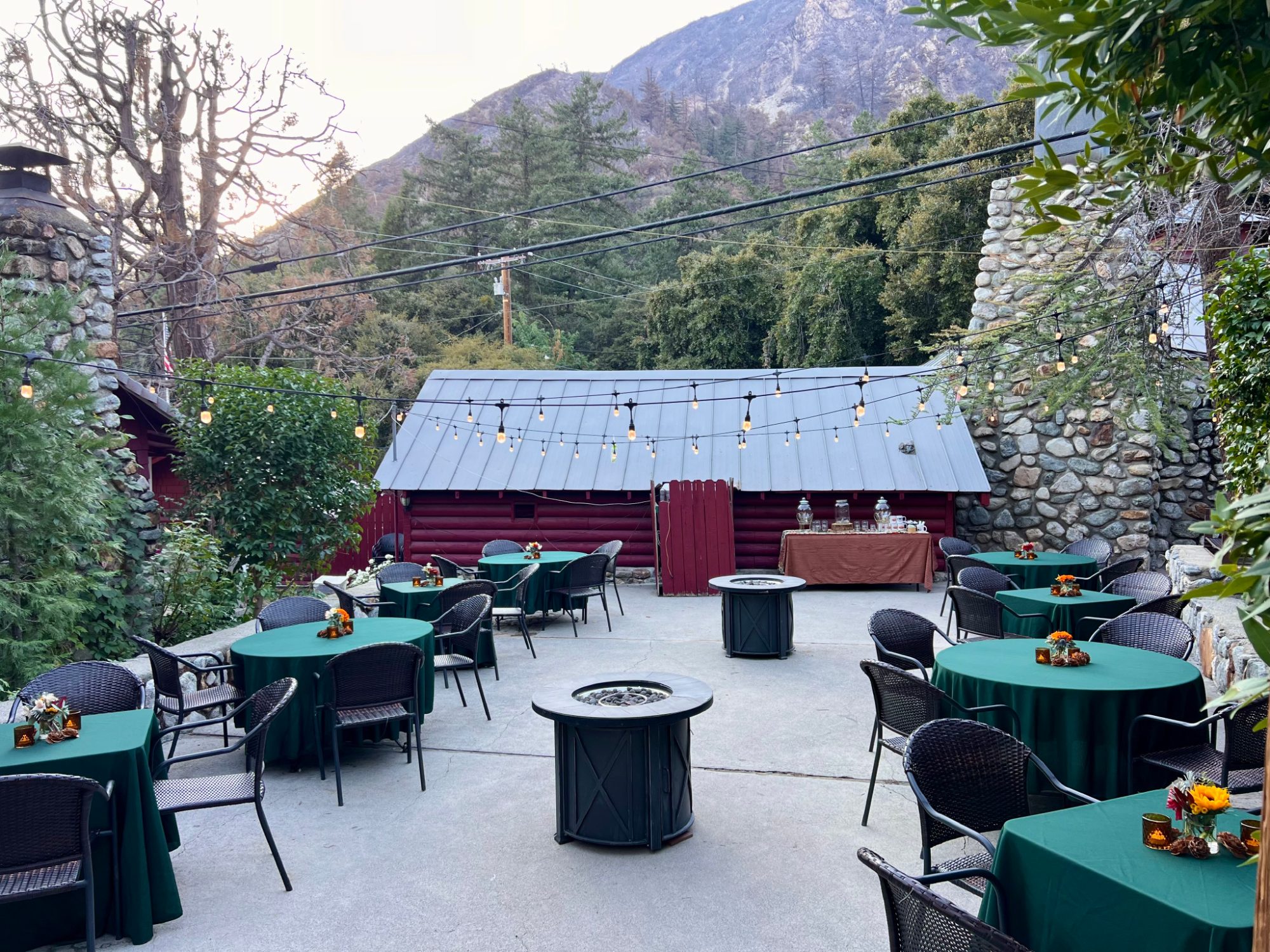 The Lodge patio set for a party with the mountain behind