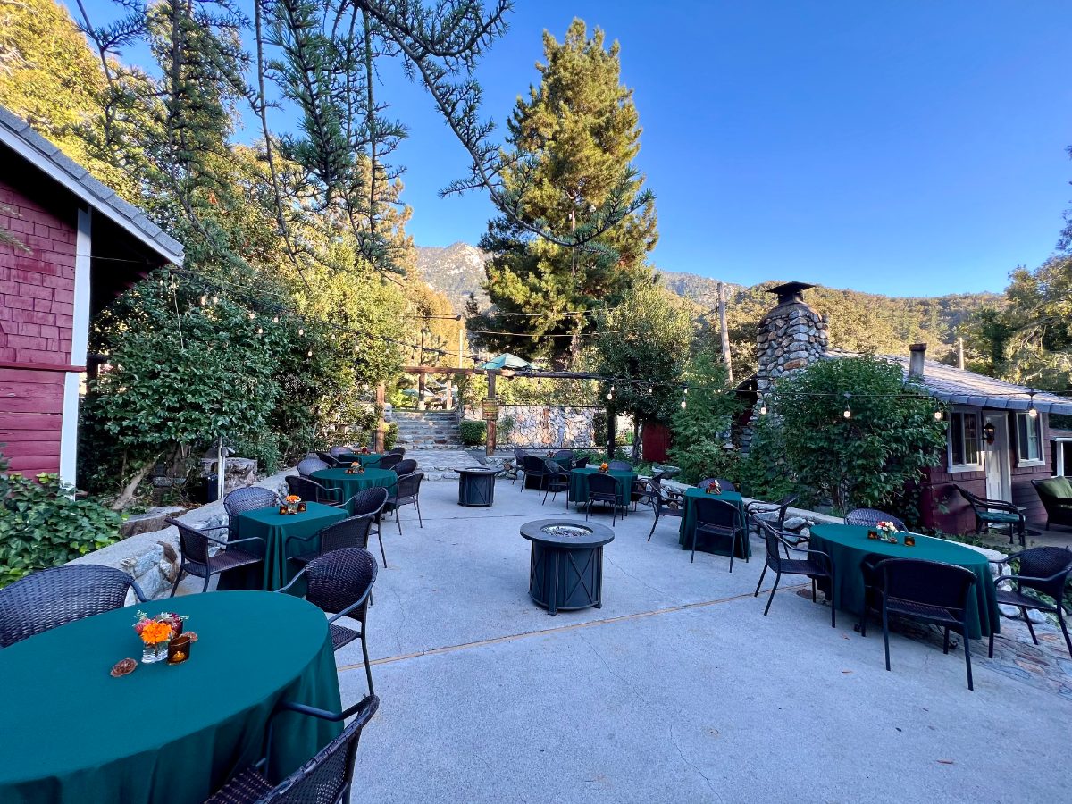 Patio tables beside the red cabins