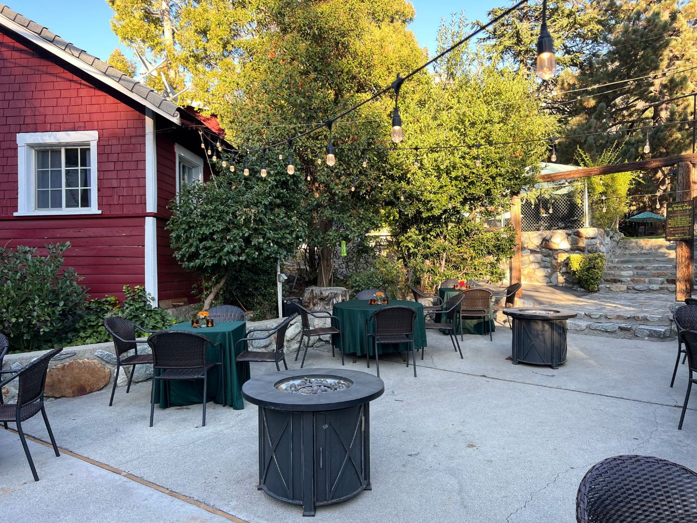 The patio and red cabins on a sunny afternoon