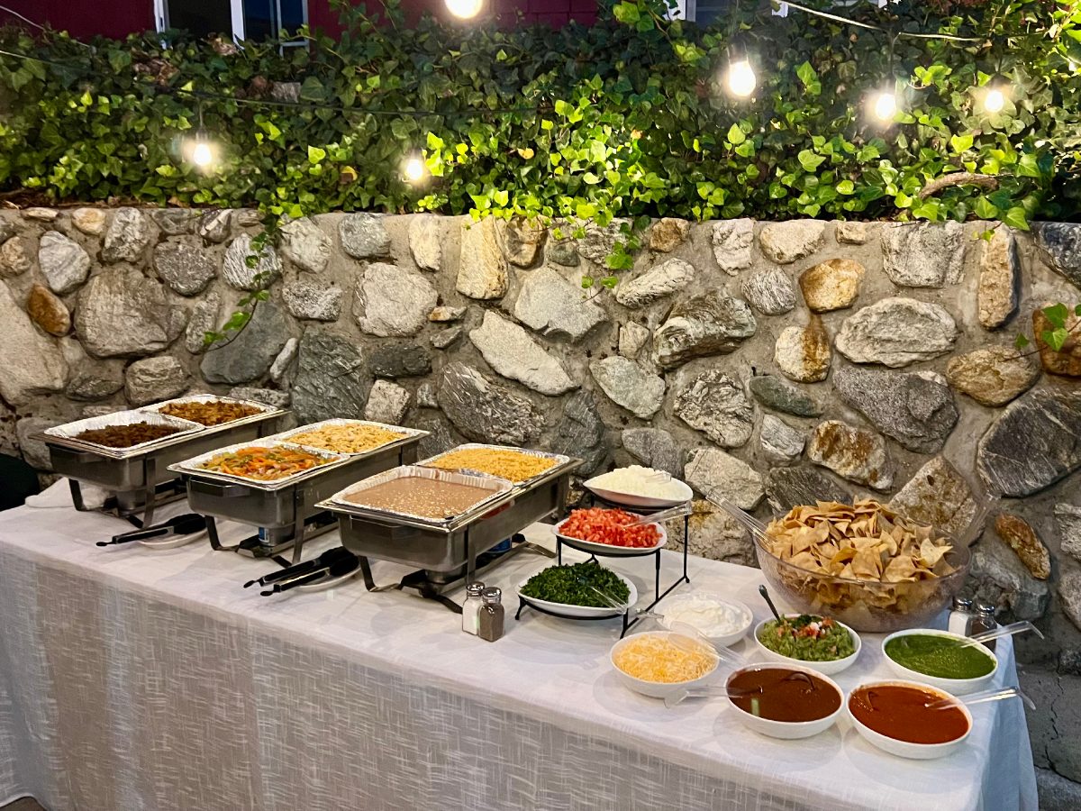 A buffet set up under string lights