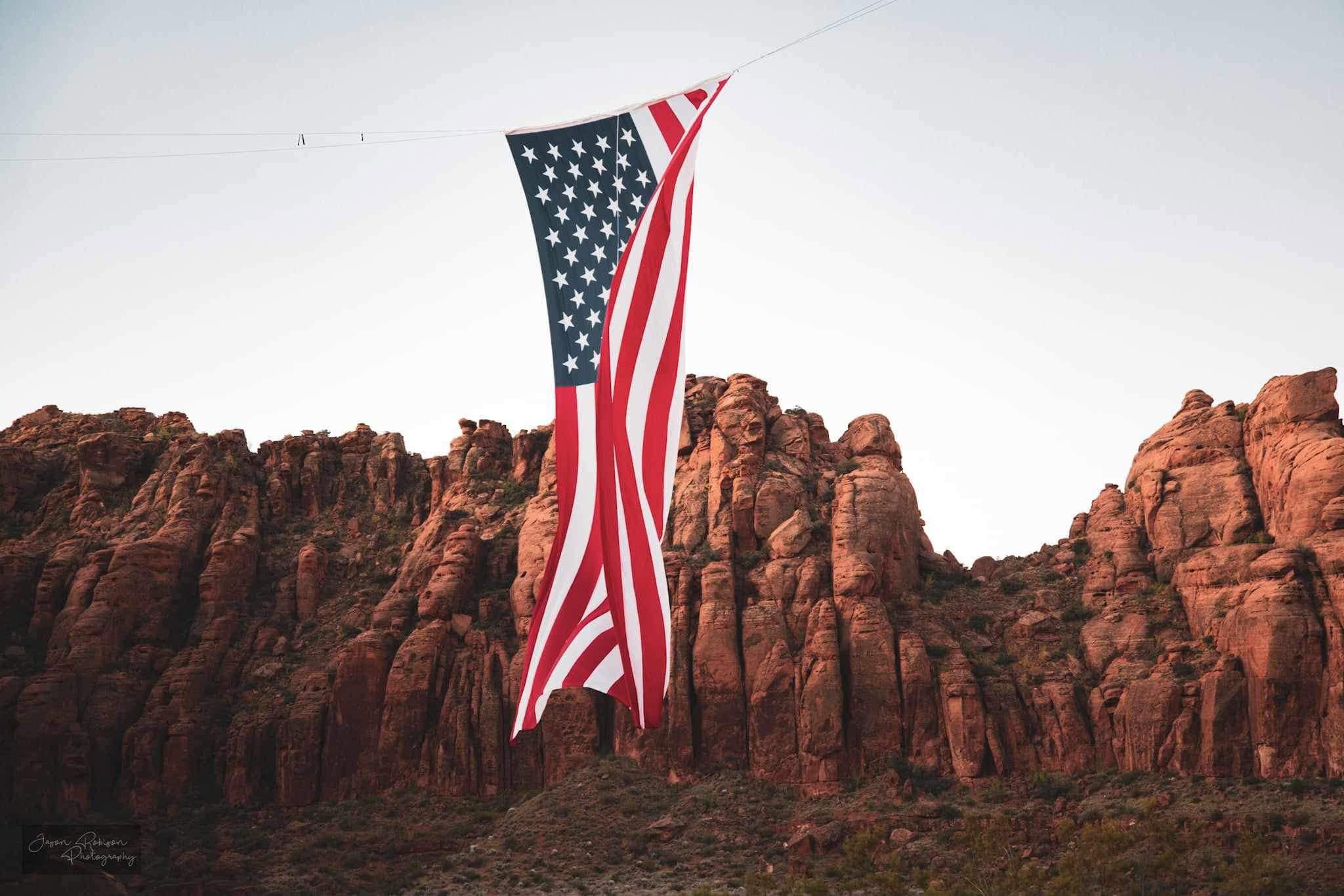 Rigging team securing the flag lines along the canyon rim