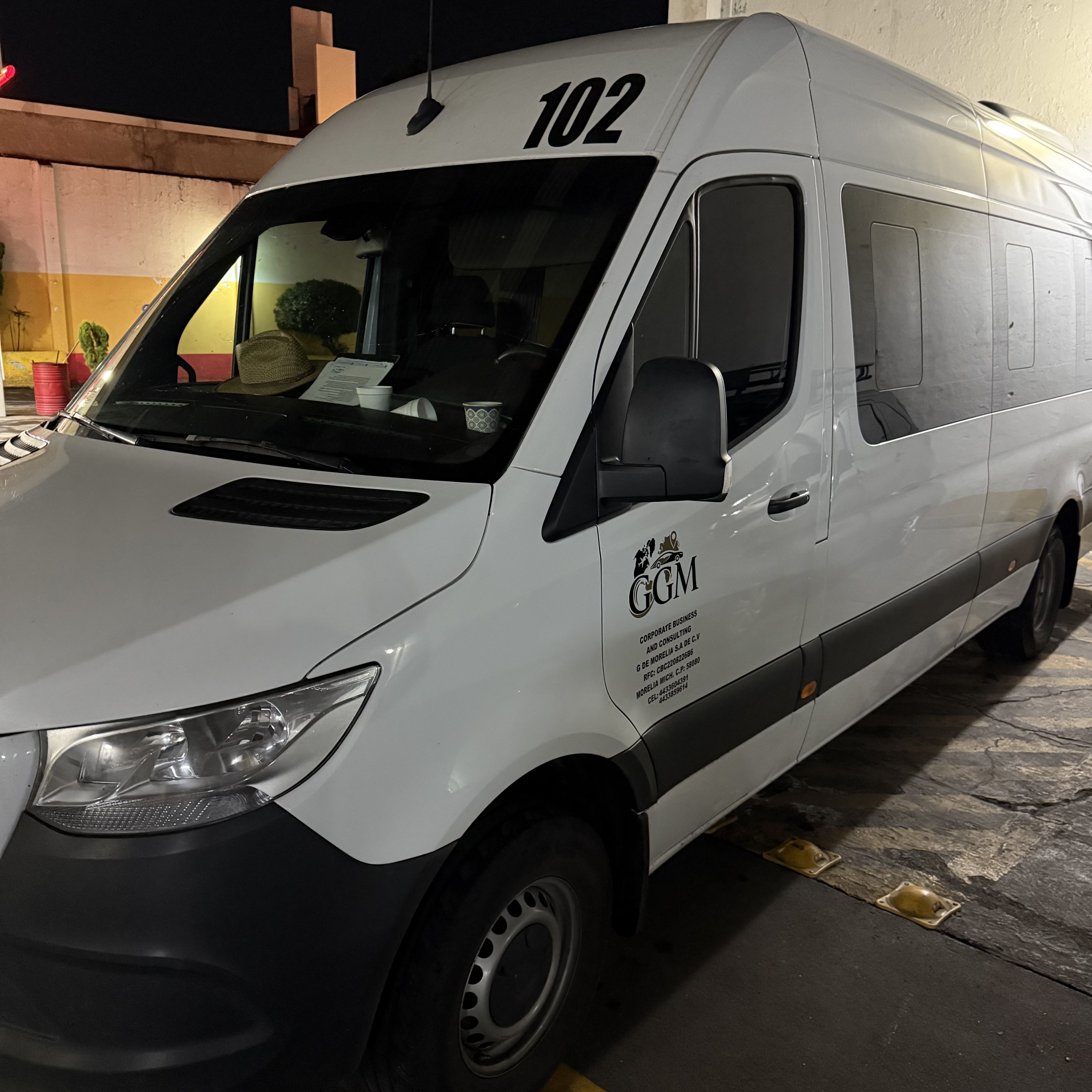 red and black bus on gray road